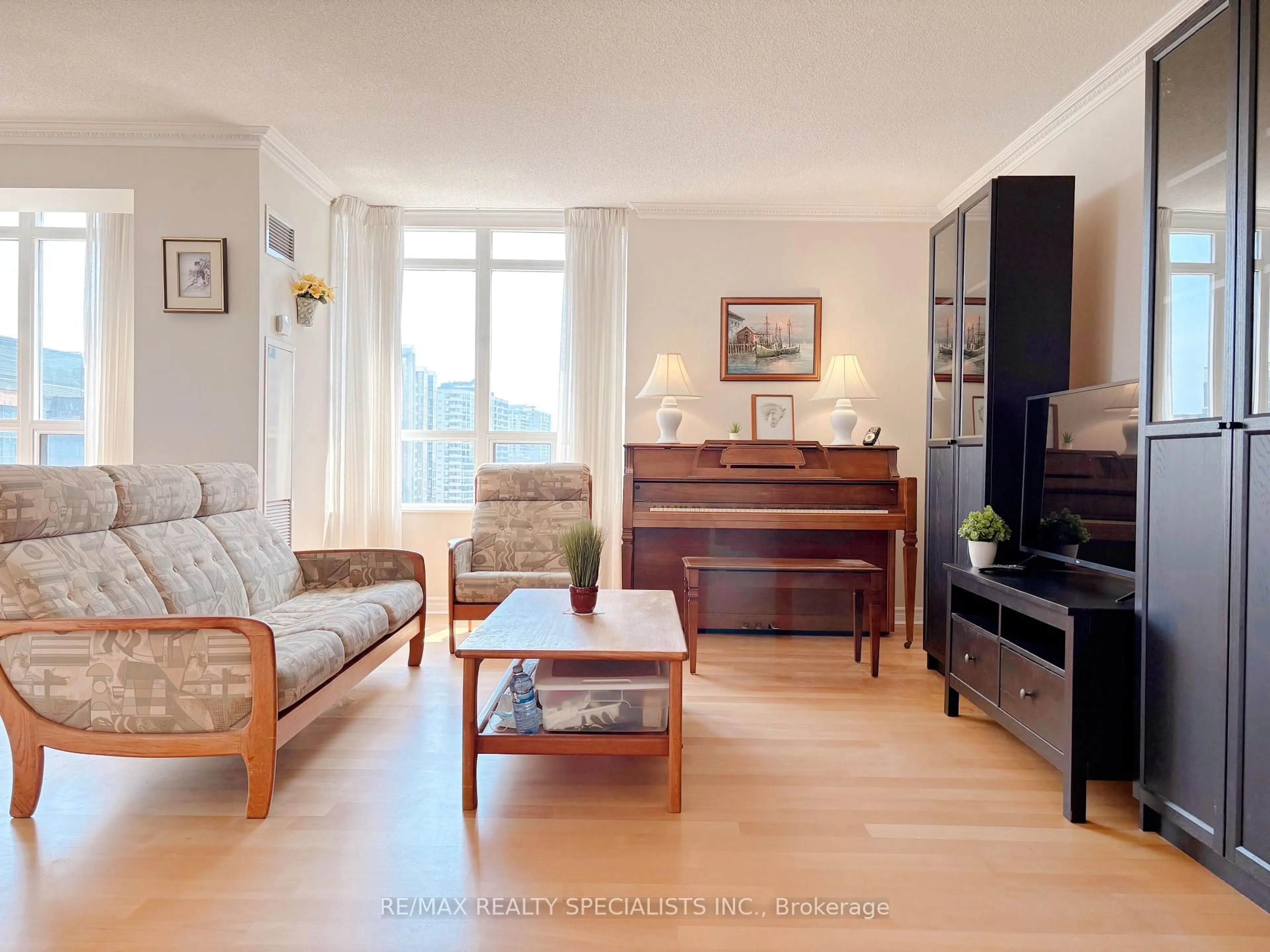 Living room with furniture, wood/laminate floor for 3880 Duke Of York Blvd #1415, Mississauga Ontario L5B 4M7