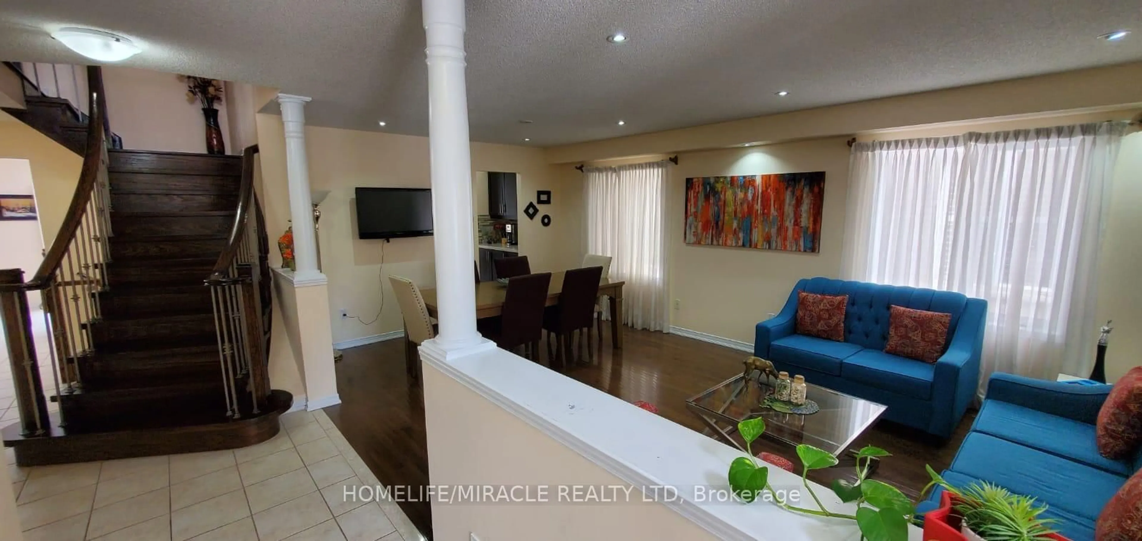 Living room with furniture, wood/laminate floor for 28 Bramfield St, Brampton Ontario L7A 2W2