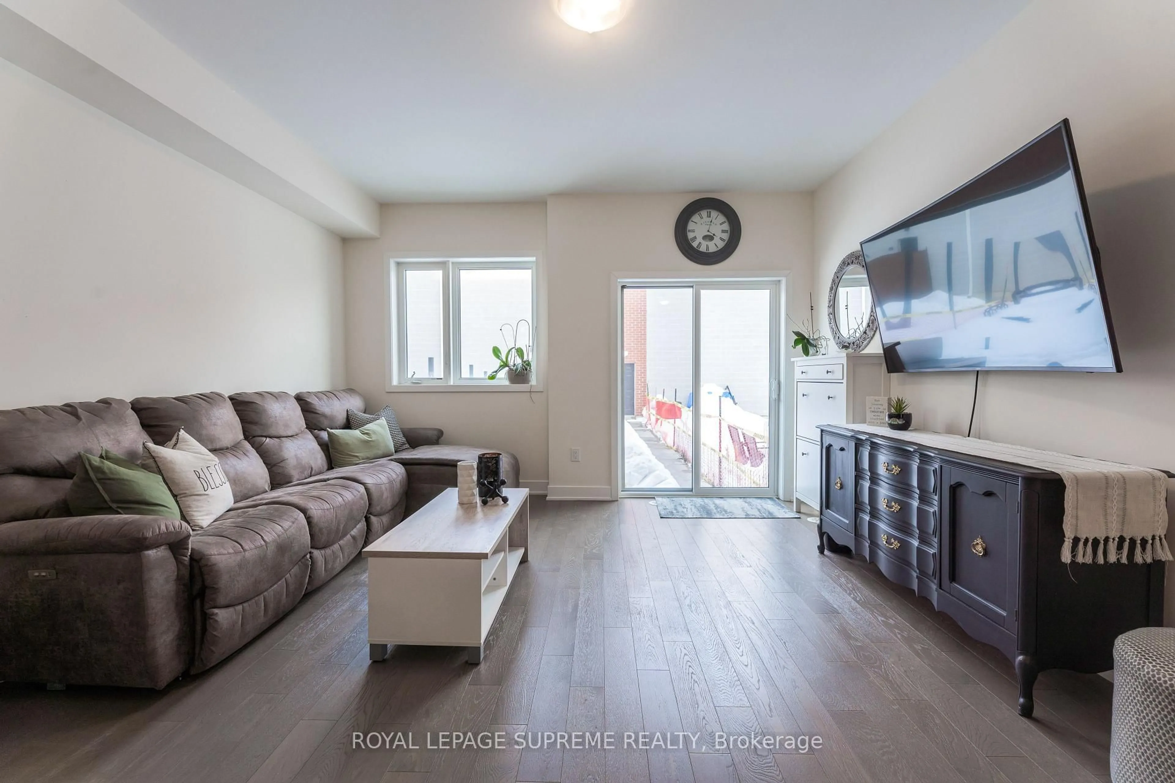 Living room with furniture, wood/laminate floor for 115 William Duncan Rd, Toronto Ontario M3K 0C7