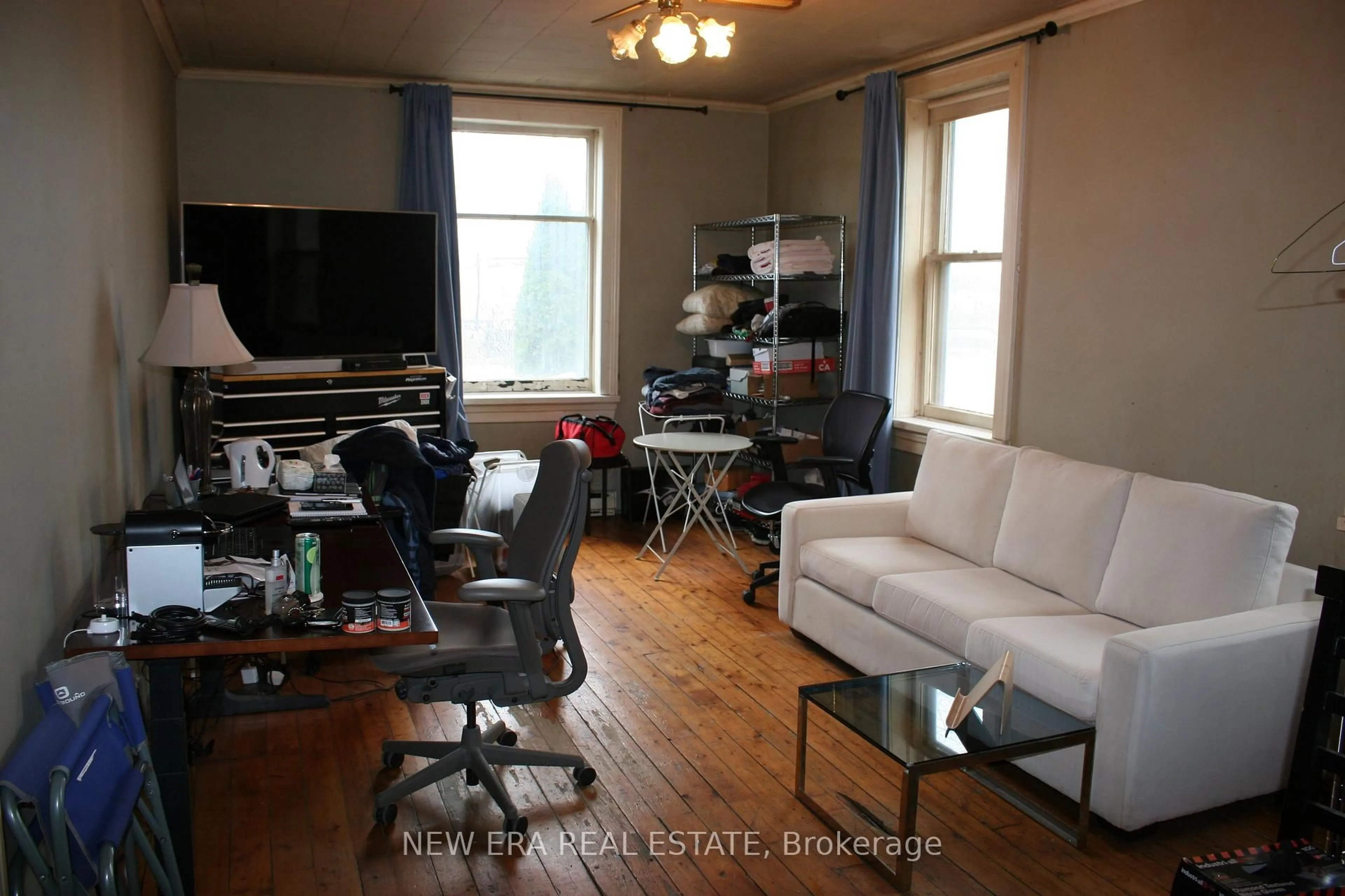 Living room with furniture, wood/laminate floor for 9072 Guelph Junction Rd, Milton Ontario L0P 1B0