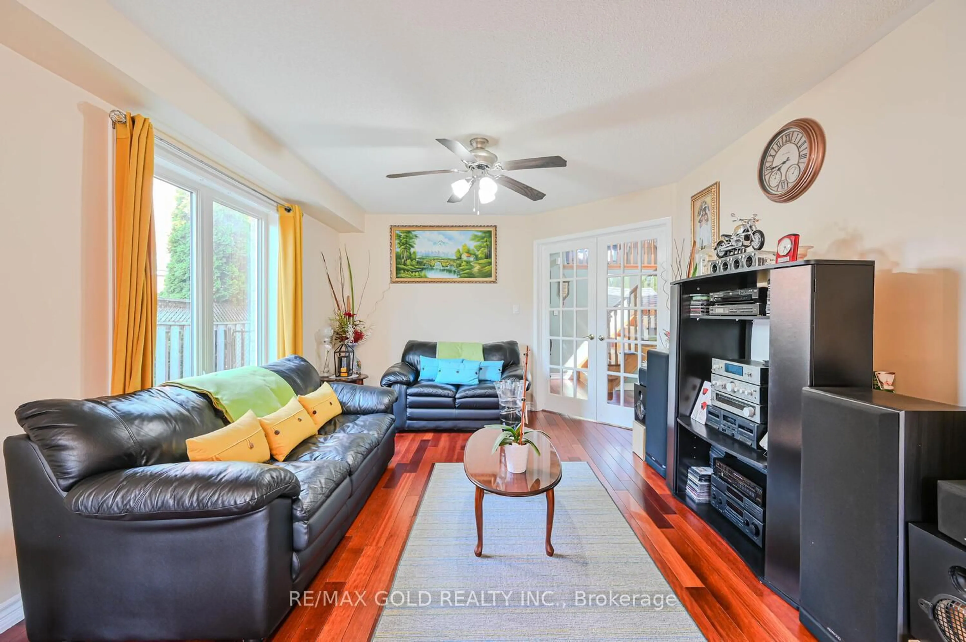 Living room with furniture, wood/laminate floor for 47 Seclusion Cres, Brampton Ontario L6R 1L5