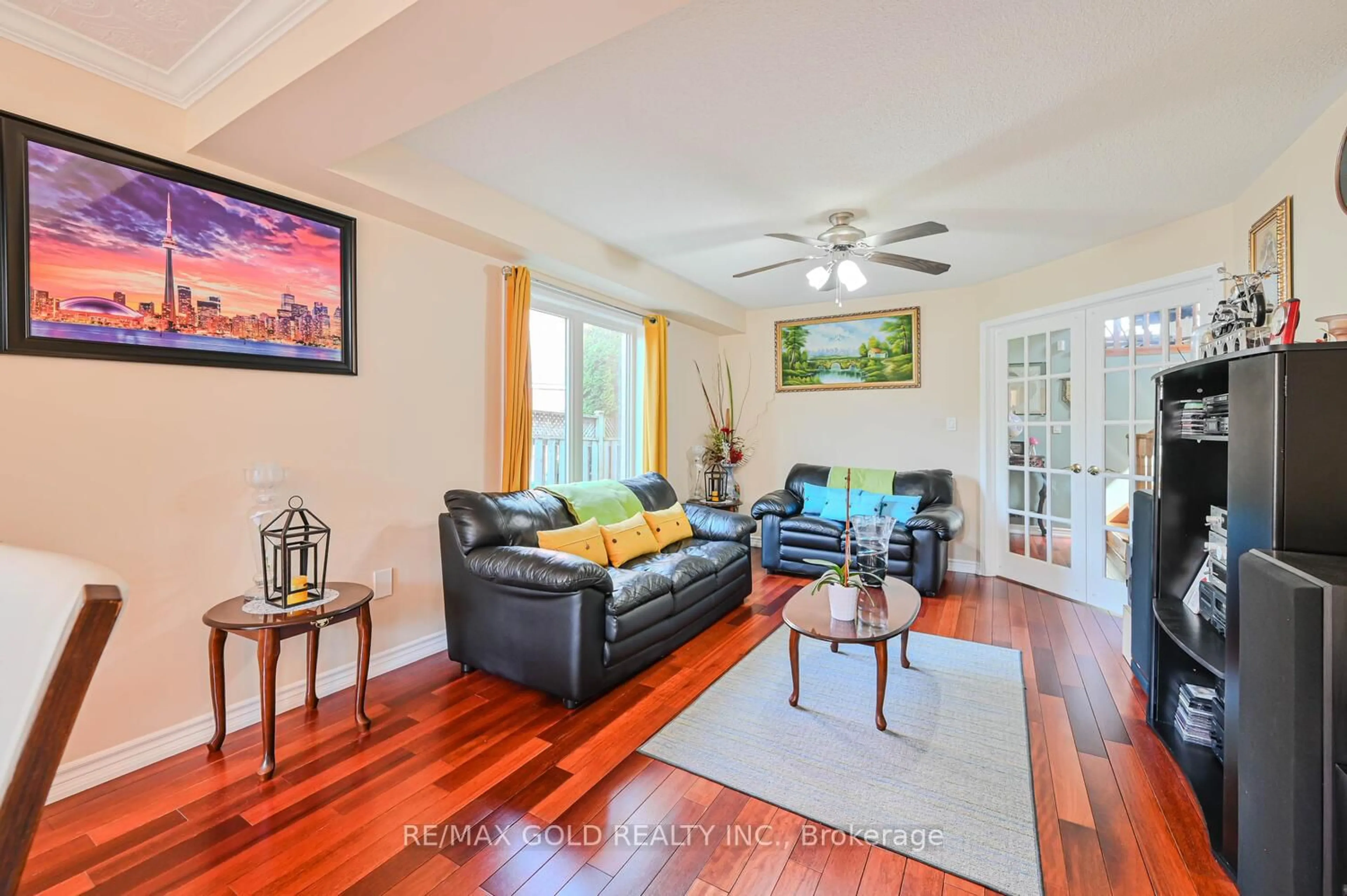 Living room with furniture, wood/laminate floor for 47 Seclusion Cres, Brampton Ontario L6R 1L5