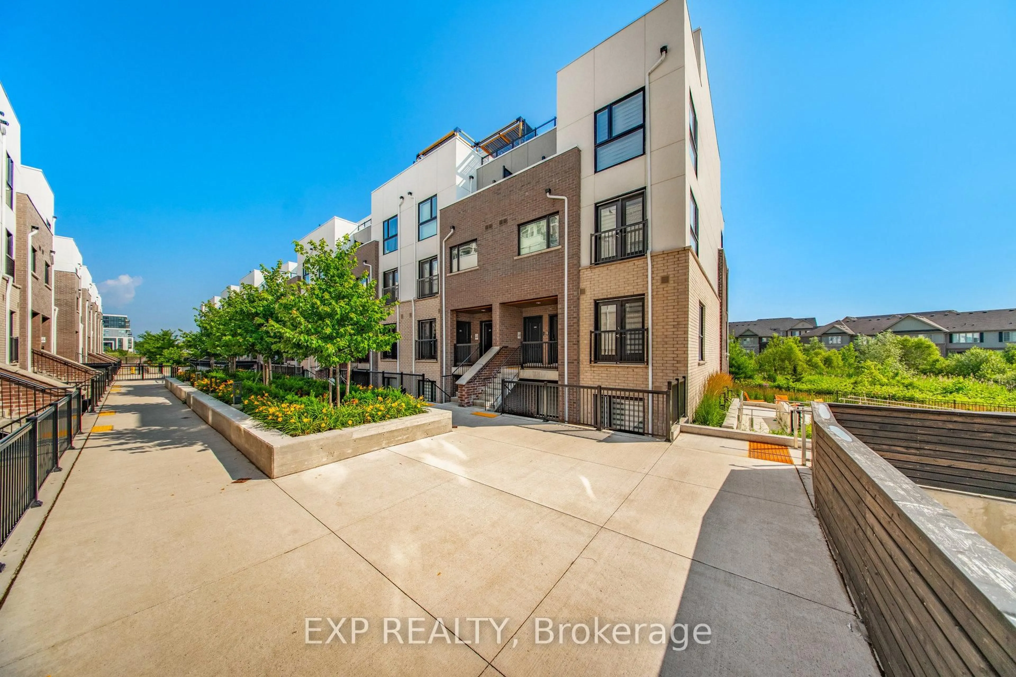 A pic from outside/outdoor area/front of a property/back of a property/a pic from drone, unknown for 349 Wheat Boom Dr #335, Oakville Ontario L6H 7X5