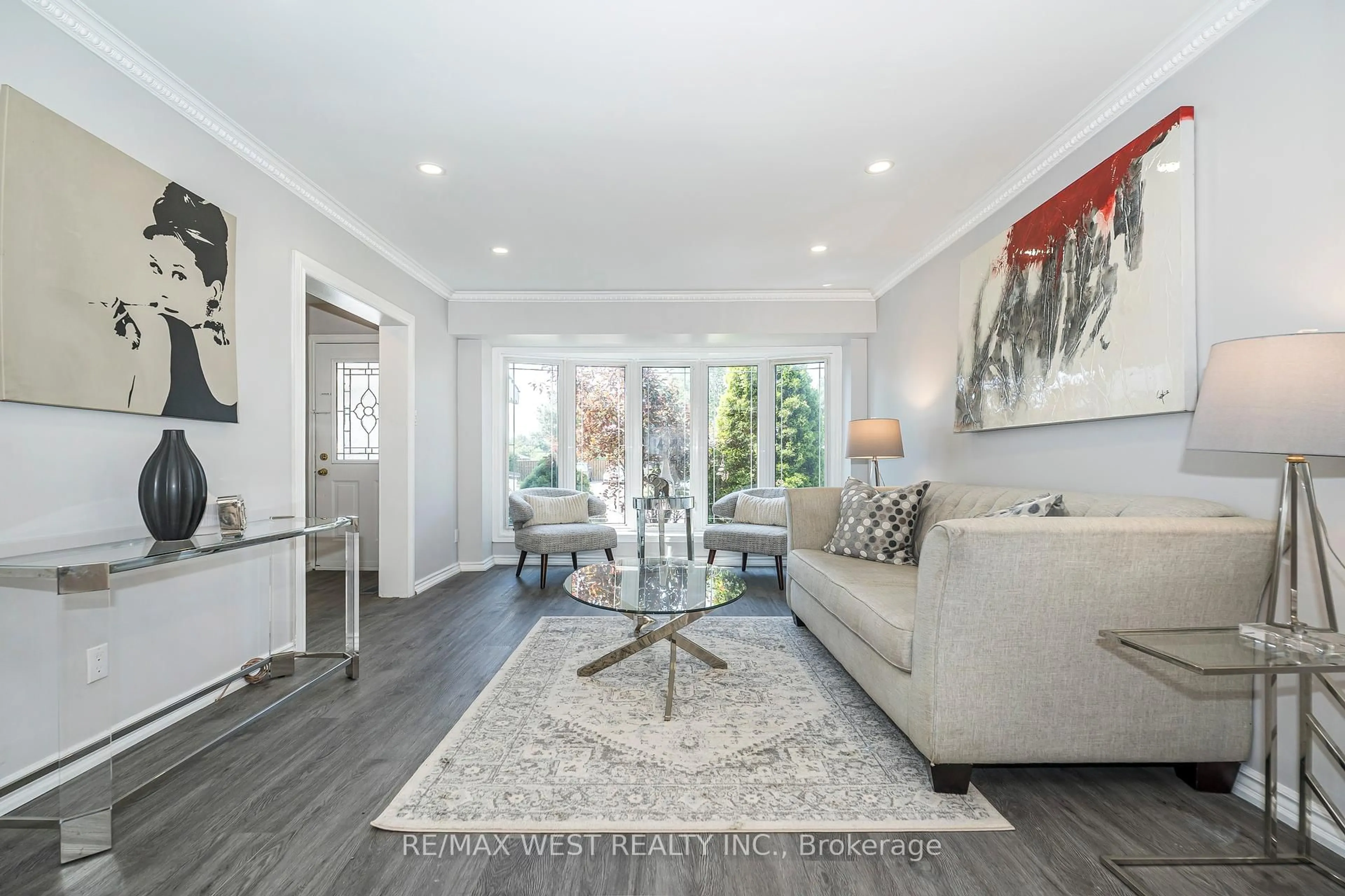 Living room with furniture, wood/laminate floor for 128 Avondale Blvd, Brampton Ontario L6T 1H7