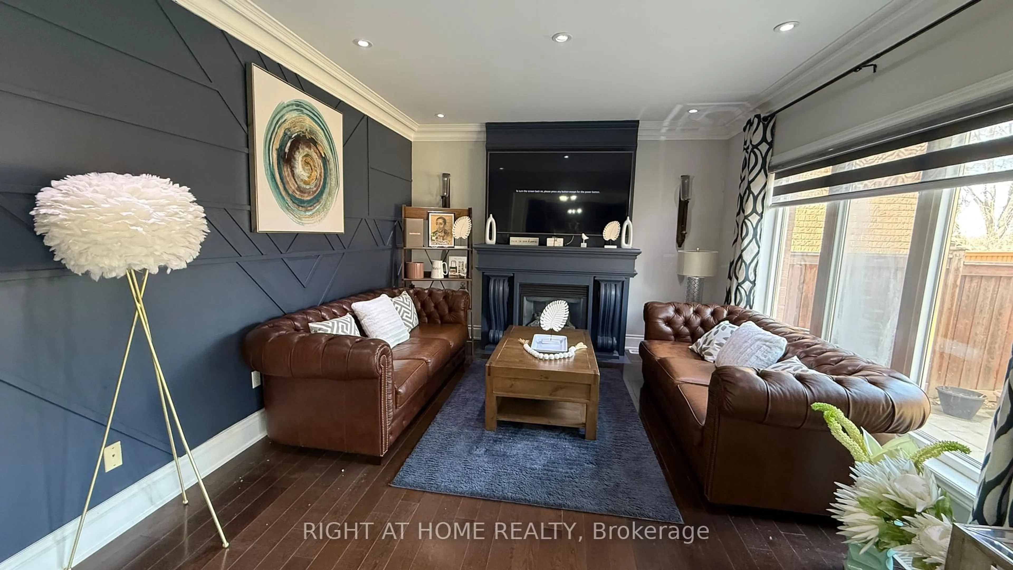 Living room with furniture, wood/laminate floor for 7 Yellow Avens Blvd, Brampton Ontario L6R 0K5