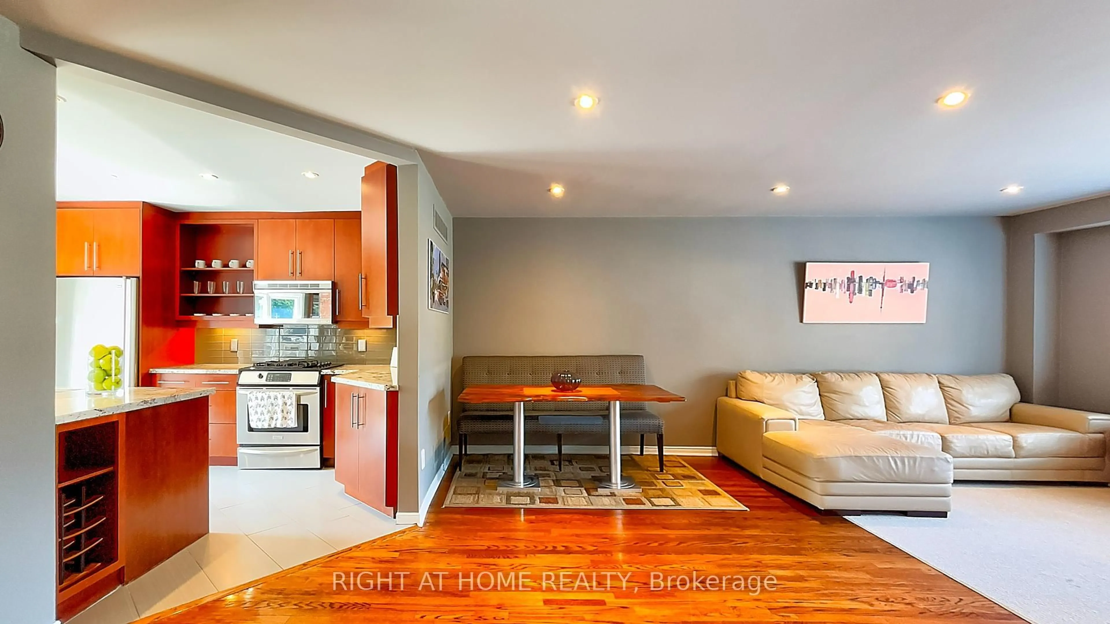 Living room with furniture, wood/laminate floor for 50 Tamarack Circ, Toronto Ontario M9P 3T9