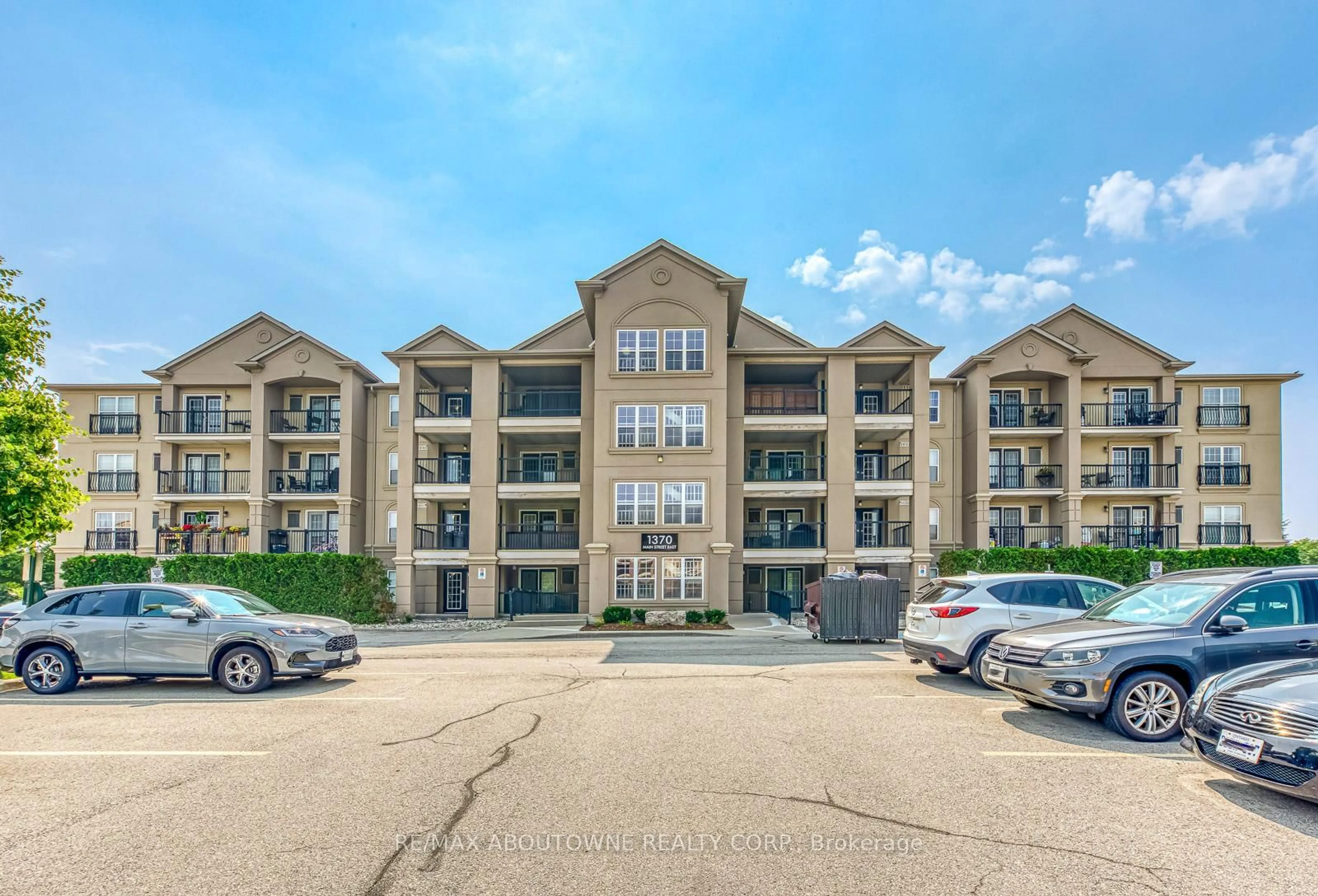 A pic from outside/outdoor area/front of a property/back of a property/a pic from drone, unknown for 1370 Main St #312, Milton Ontario L9T 7S8