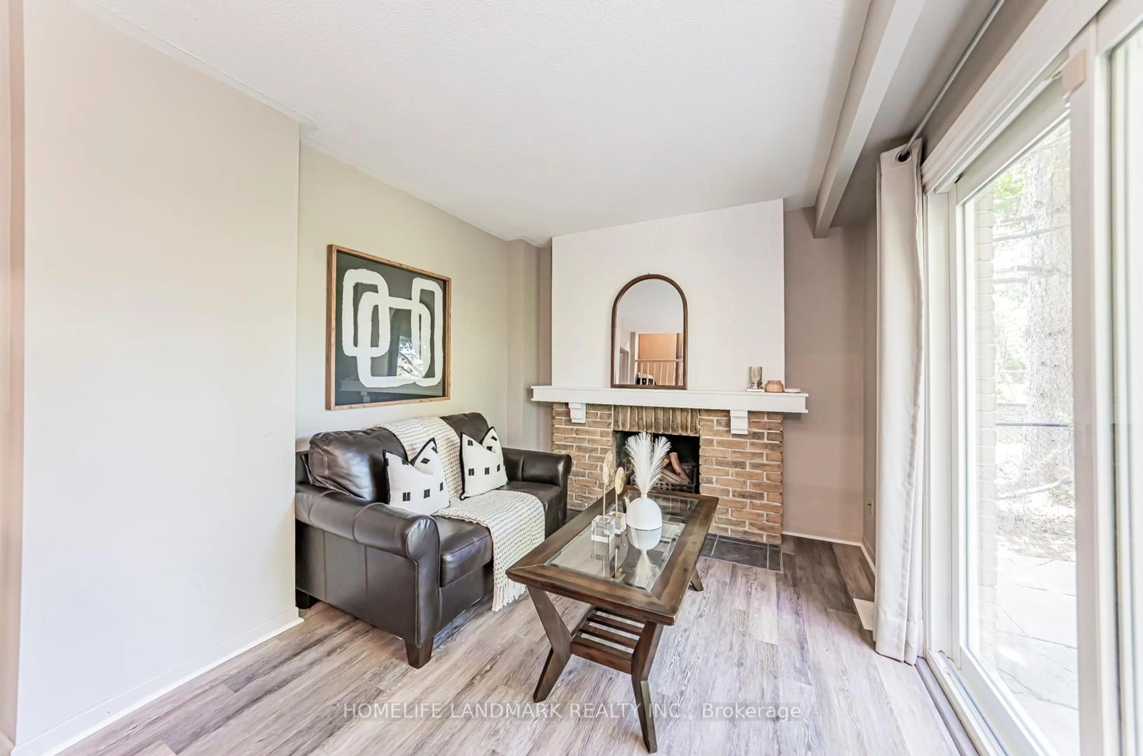 Living room with furniture, wood/laminate floor for 2581 Windjammer Rd, Mississauga Ontario L5L 1H7