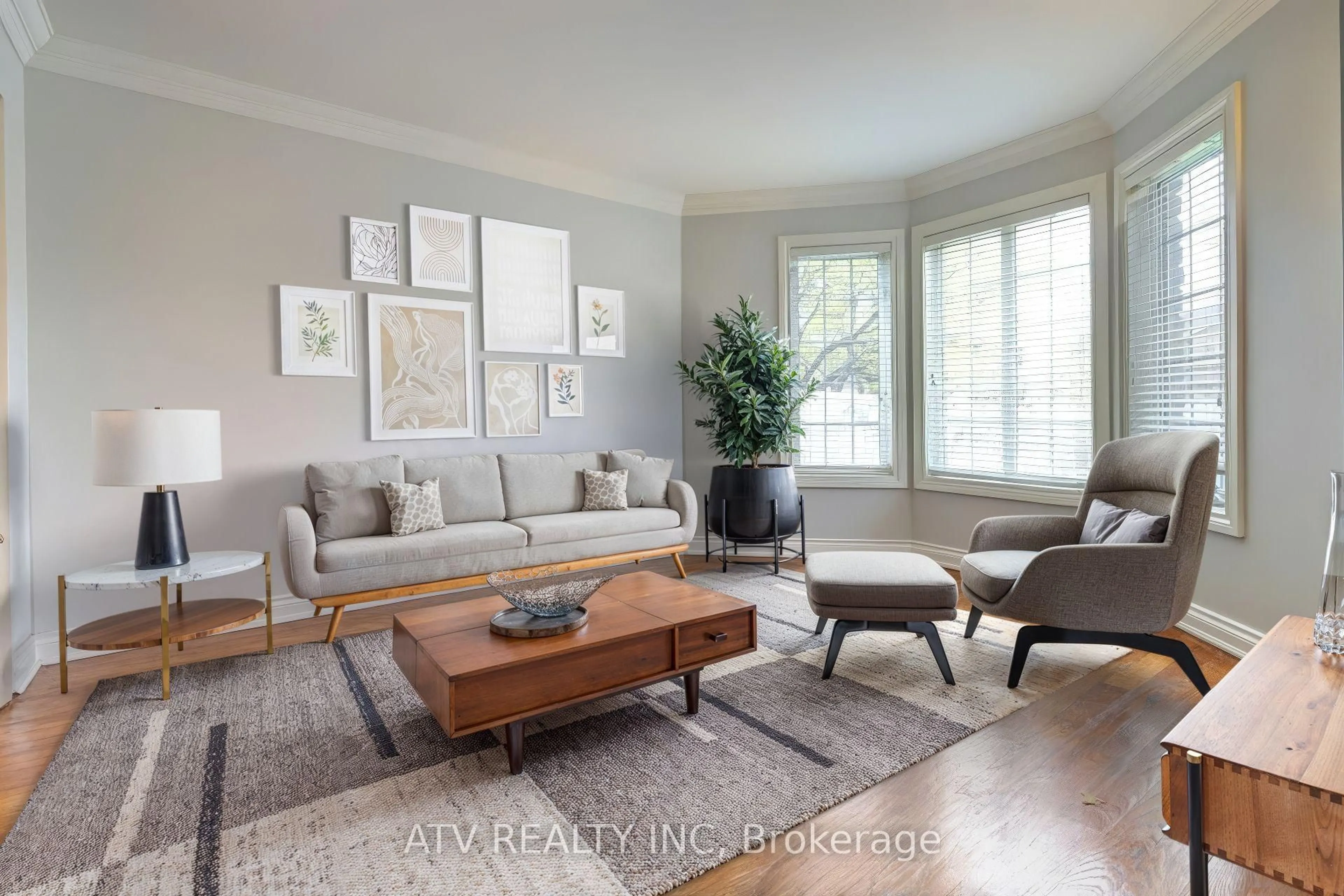 Living room with furniture, wood/laminate floor for 31 Shaver Ave, Toronto Ontario M9B 3T2