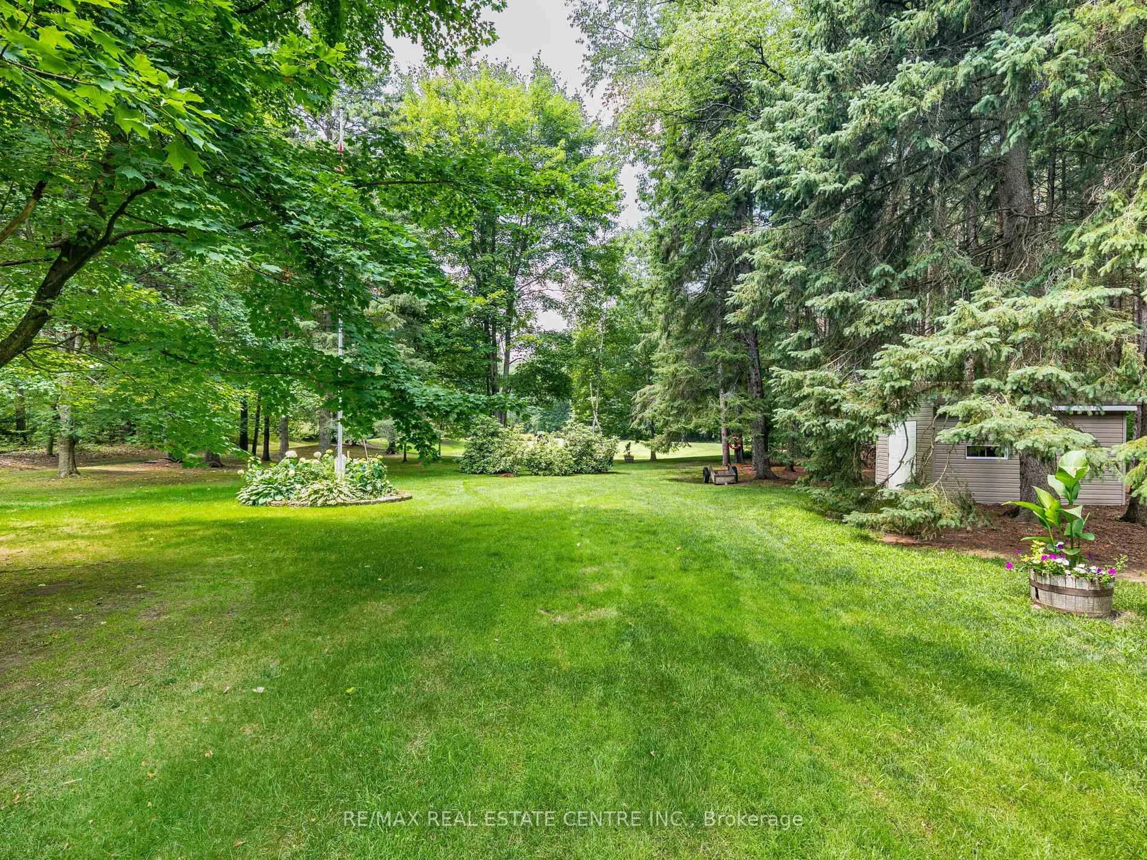 A pic from outside/outdoor area/front of a property/back of a property/a pic from drone, forest/trees view for 18 Damascus Dr, Caledon Ontario L7C 0A4