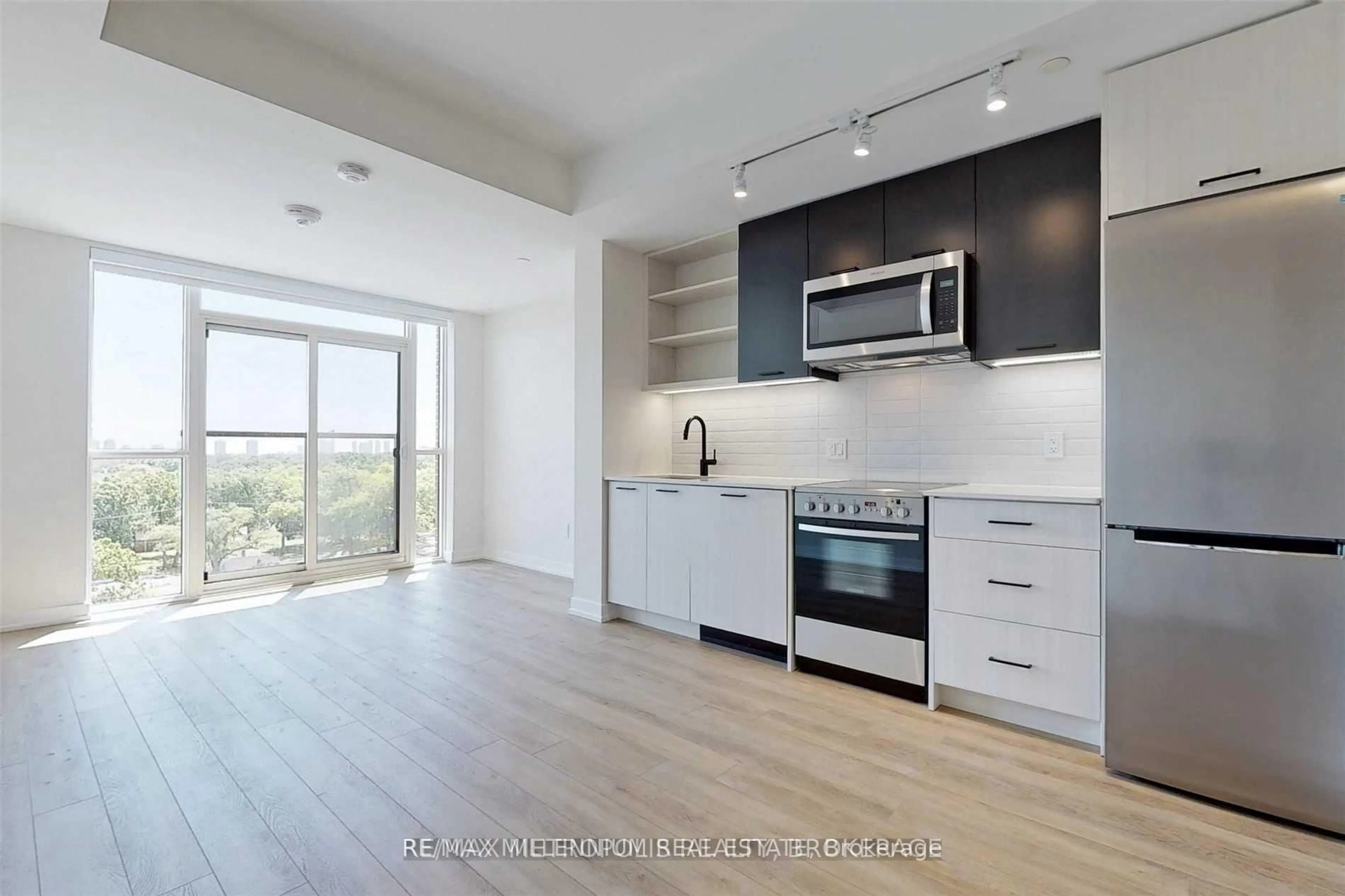 Open concept kitchen, wood/laminate floor for 2300 St Clair Ave #807, Toronto Ontario M6N 0B3