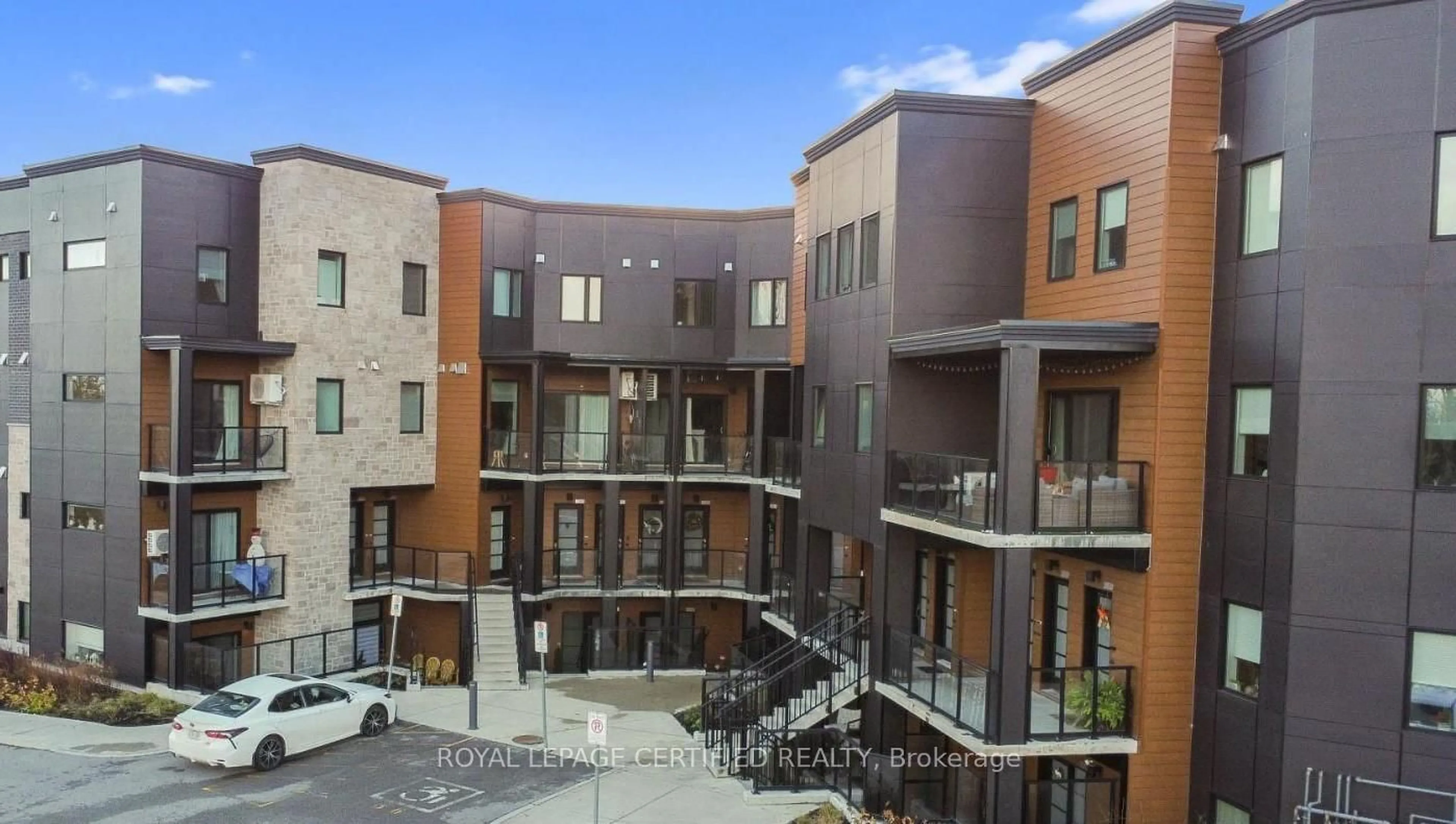 Patio, city buildings view from balcony for 17 Centre St #202, Orangeville Ontario L9W 2W9