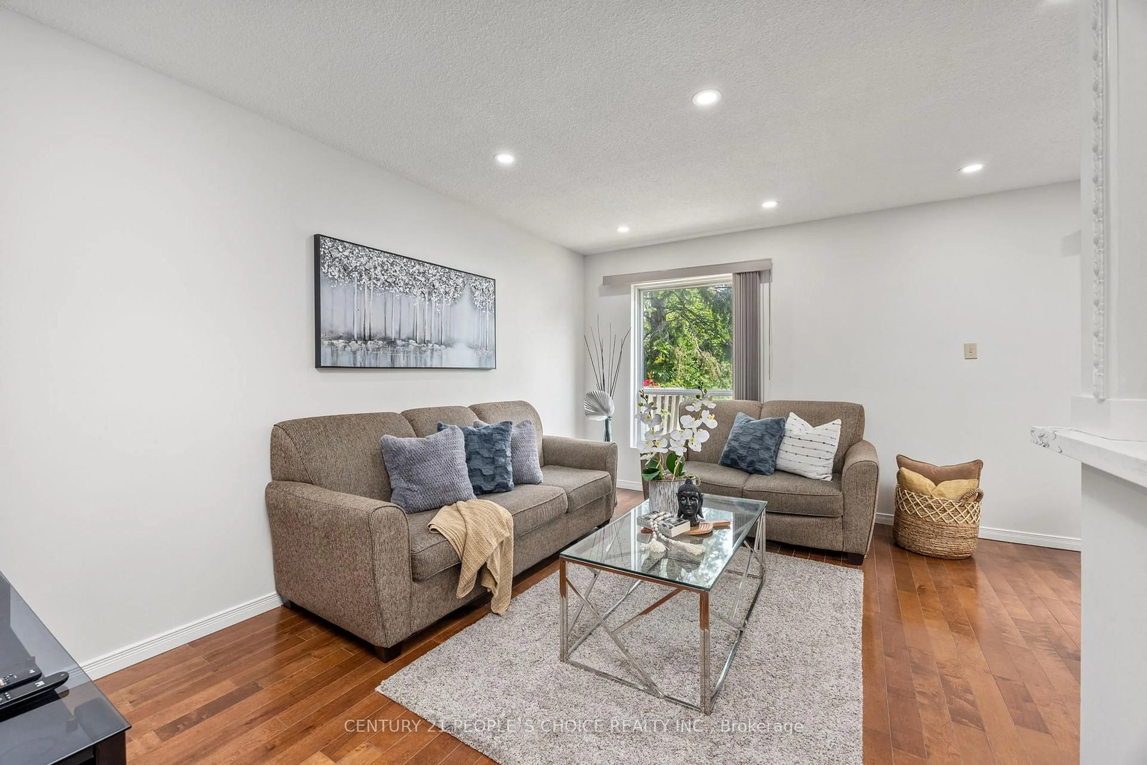 Living room with furniture, wood/laminate floor for 3500 Glen Erin Dr #23, Mississauga Ontario L5L 1W6