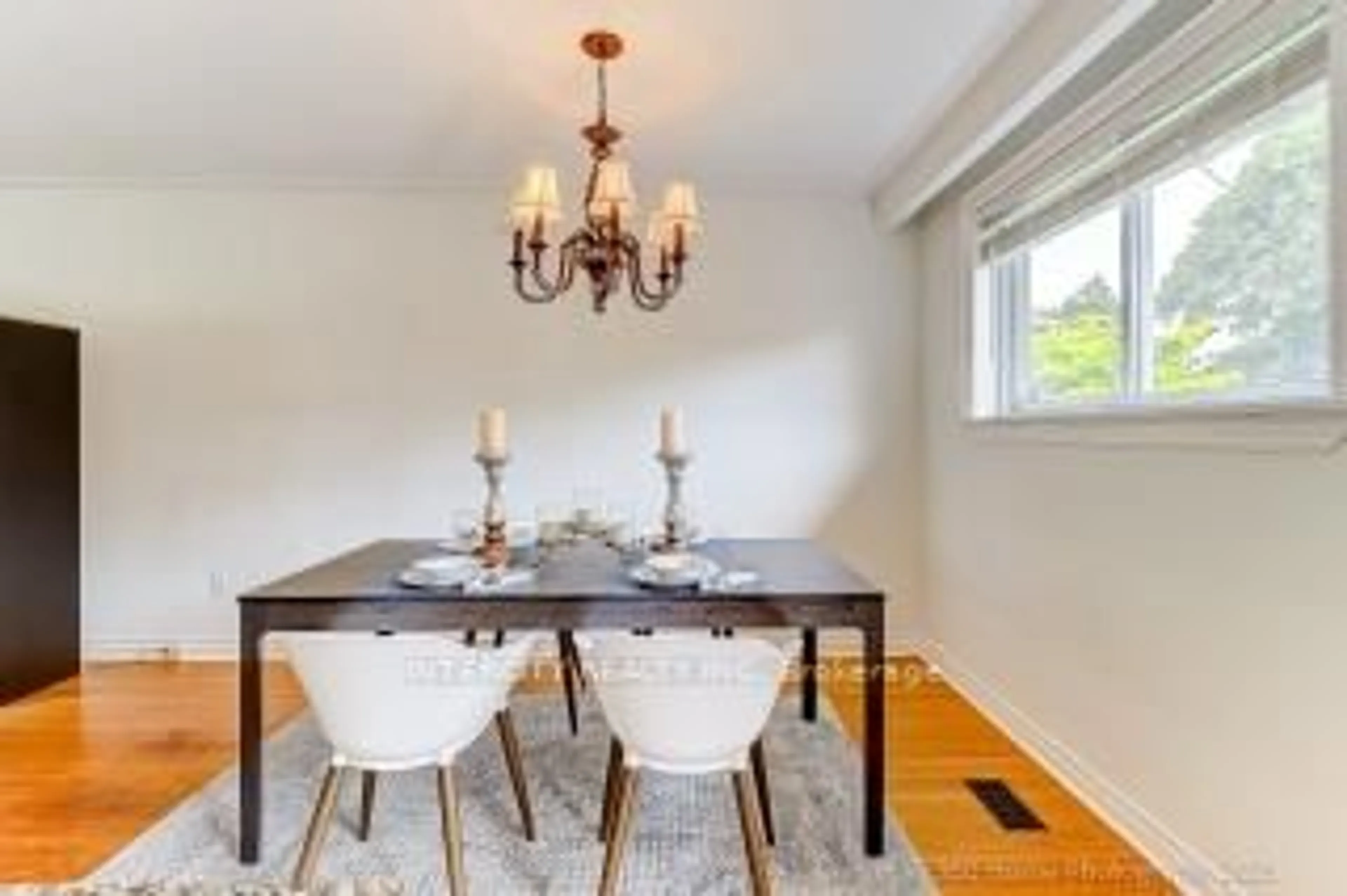 Dining room, wood/laminate floor for 44 Oxenden Cres, Toronto Ontario M9C 4H4