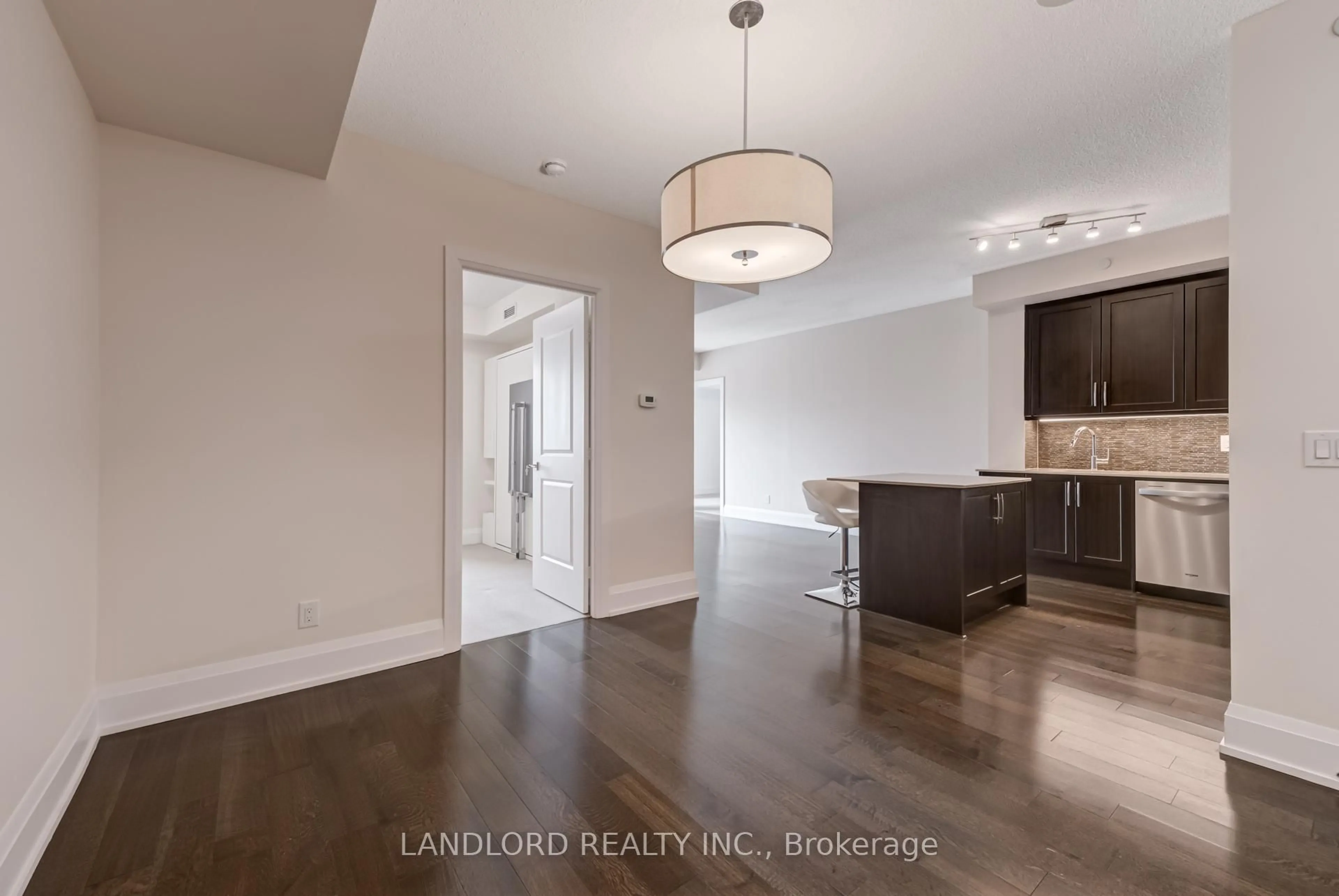 Open concept kitchen, wood/laminate floor for 1 Old Mill Dr #730, Toronto Ontario M6S 0A1