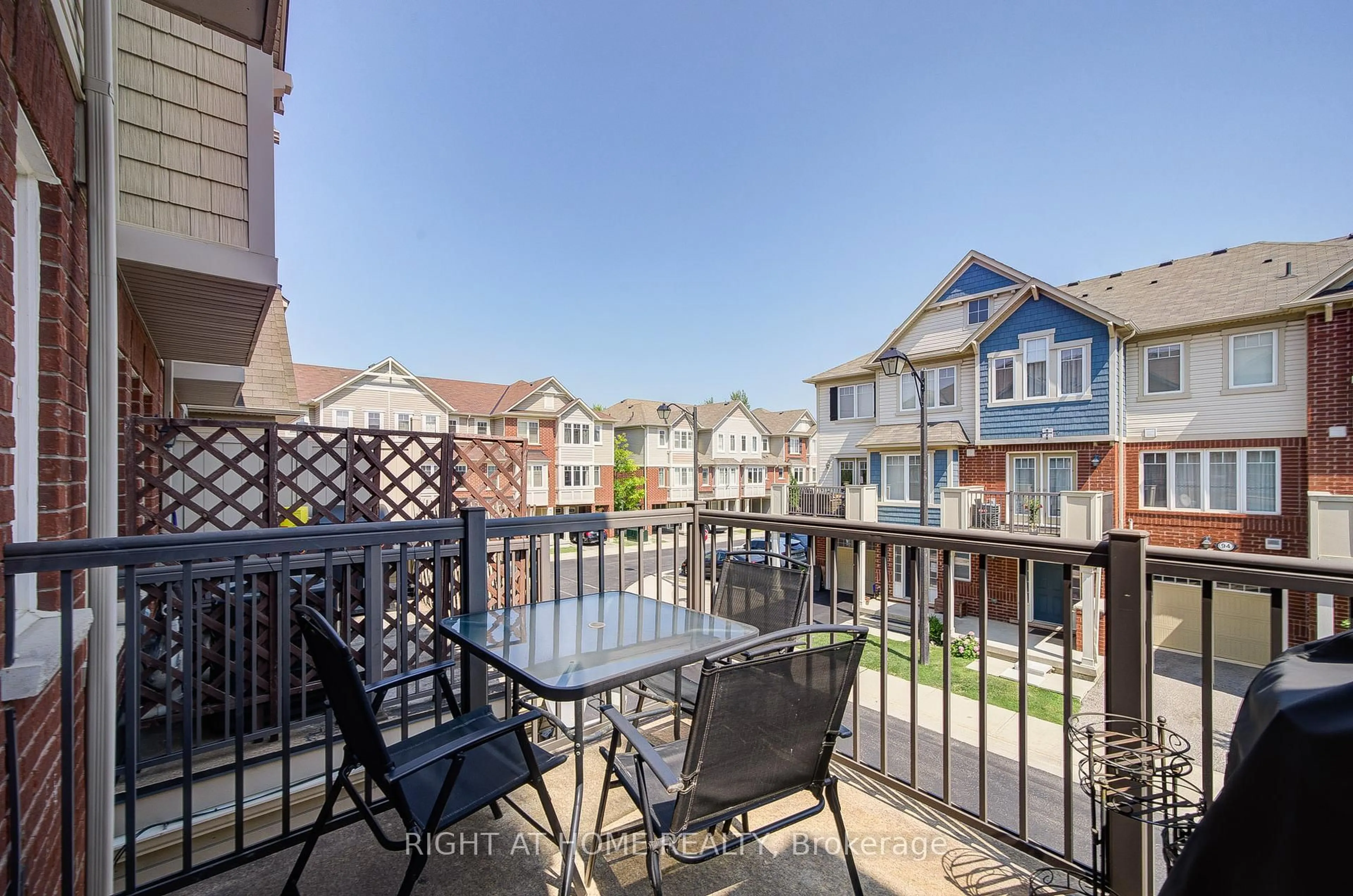 Patio, city buildings view from balcony for 6020 Derry Rd #31, Milton Ontario L9T 8L6