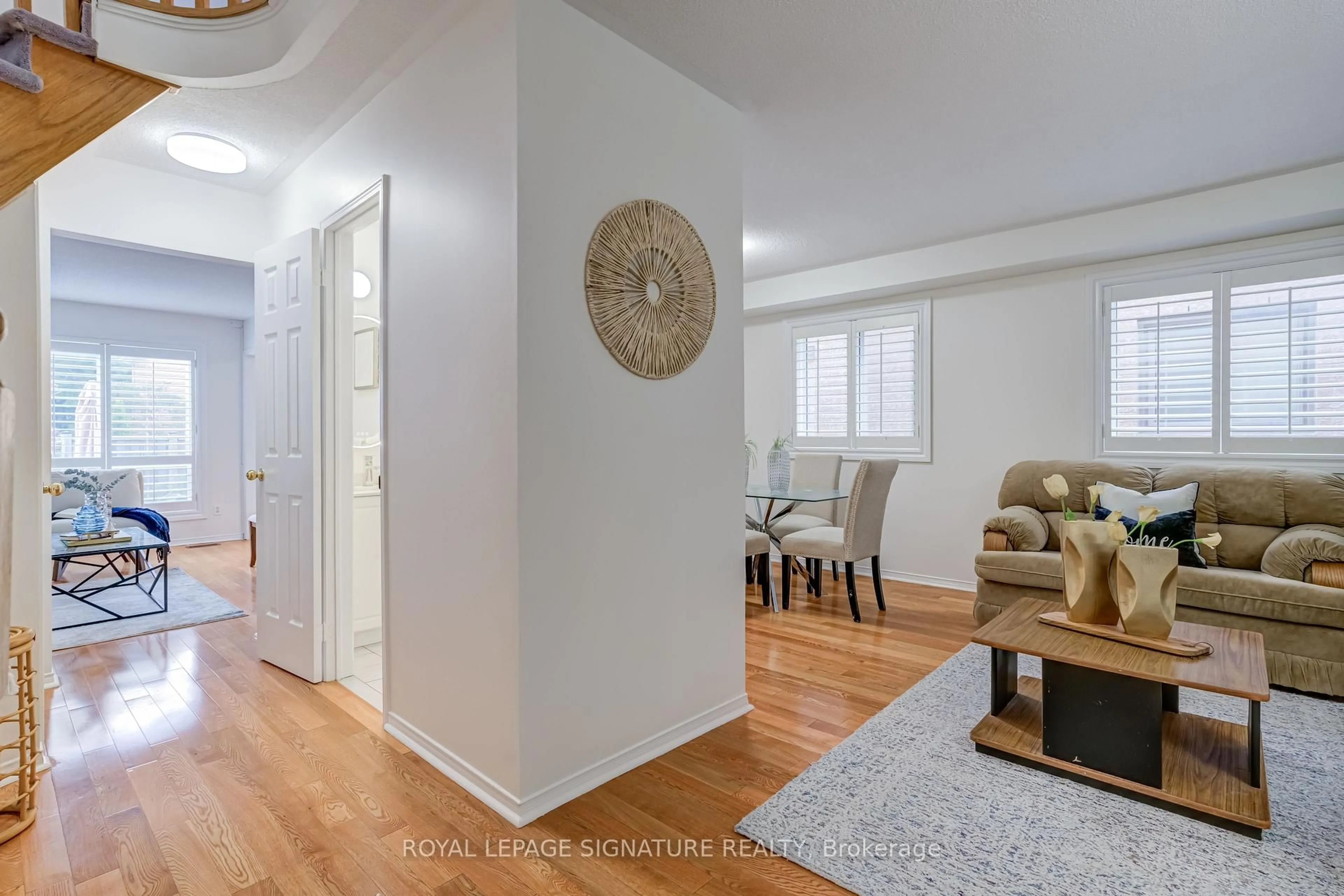 Living room with furniture, wood/laminate floor for 61 Cedarwood Cres, Brampton Ontario L6X 4J9
