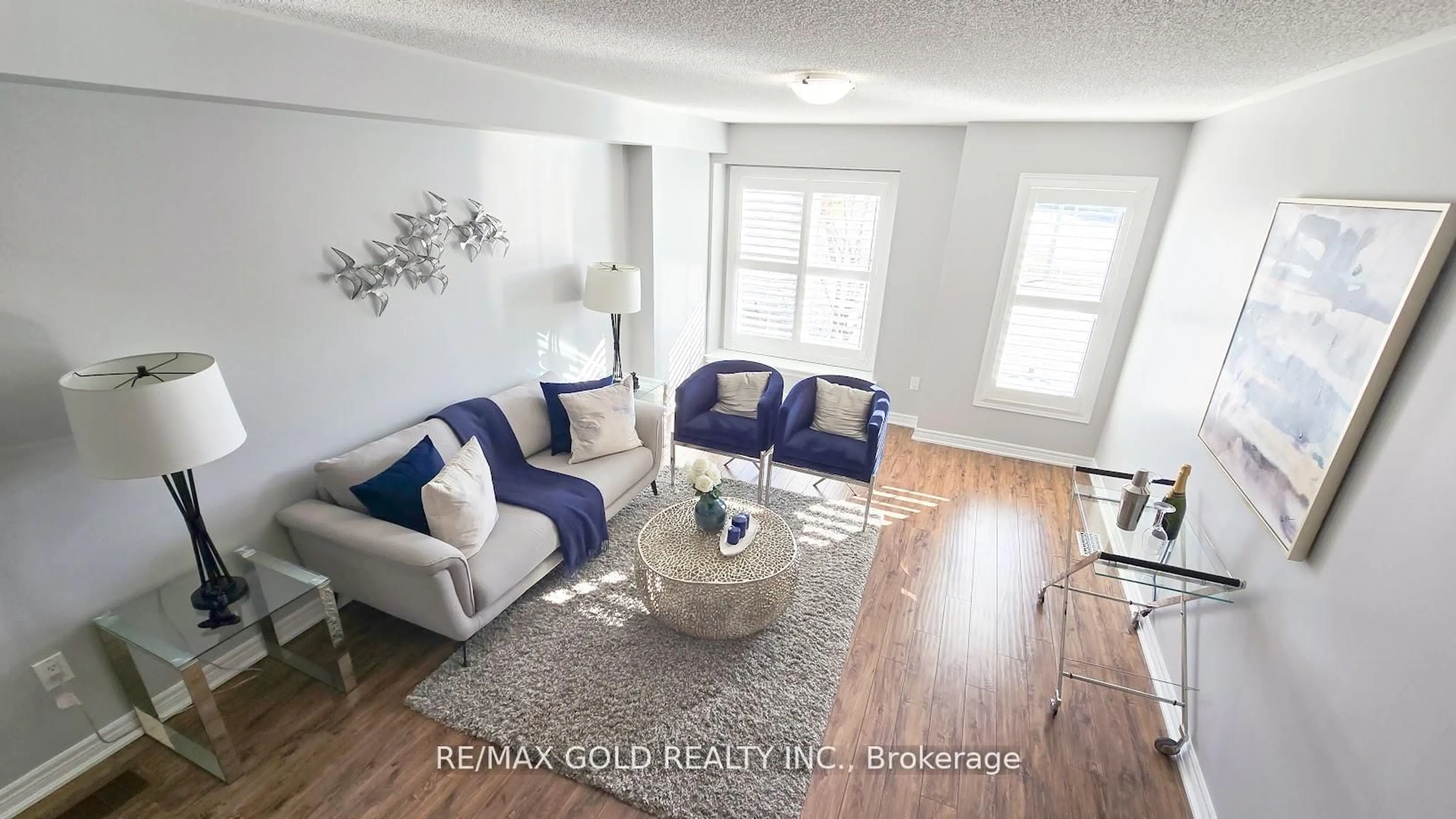 Living room with furniture, wood/laminate floor for 8 Tilden Rd, Brampton Ontario L6R 0W5
