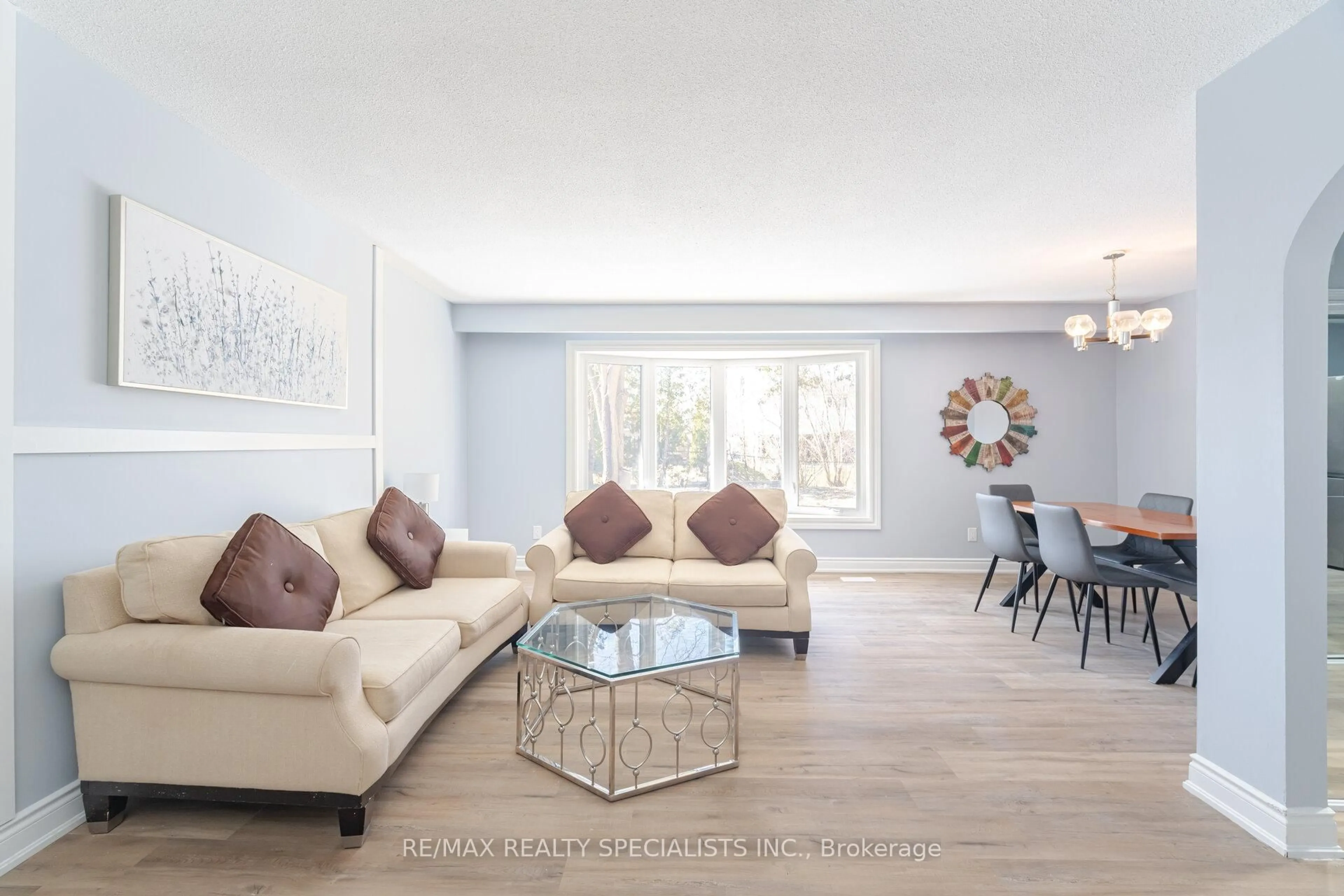 Living room with furniture, wood/laminate floor for 13 Caledon Cres, Brampton Ontario L6W 1C6