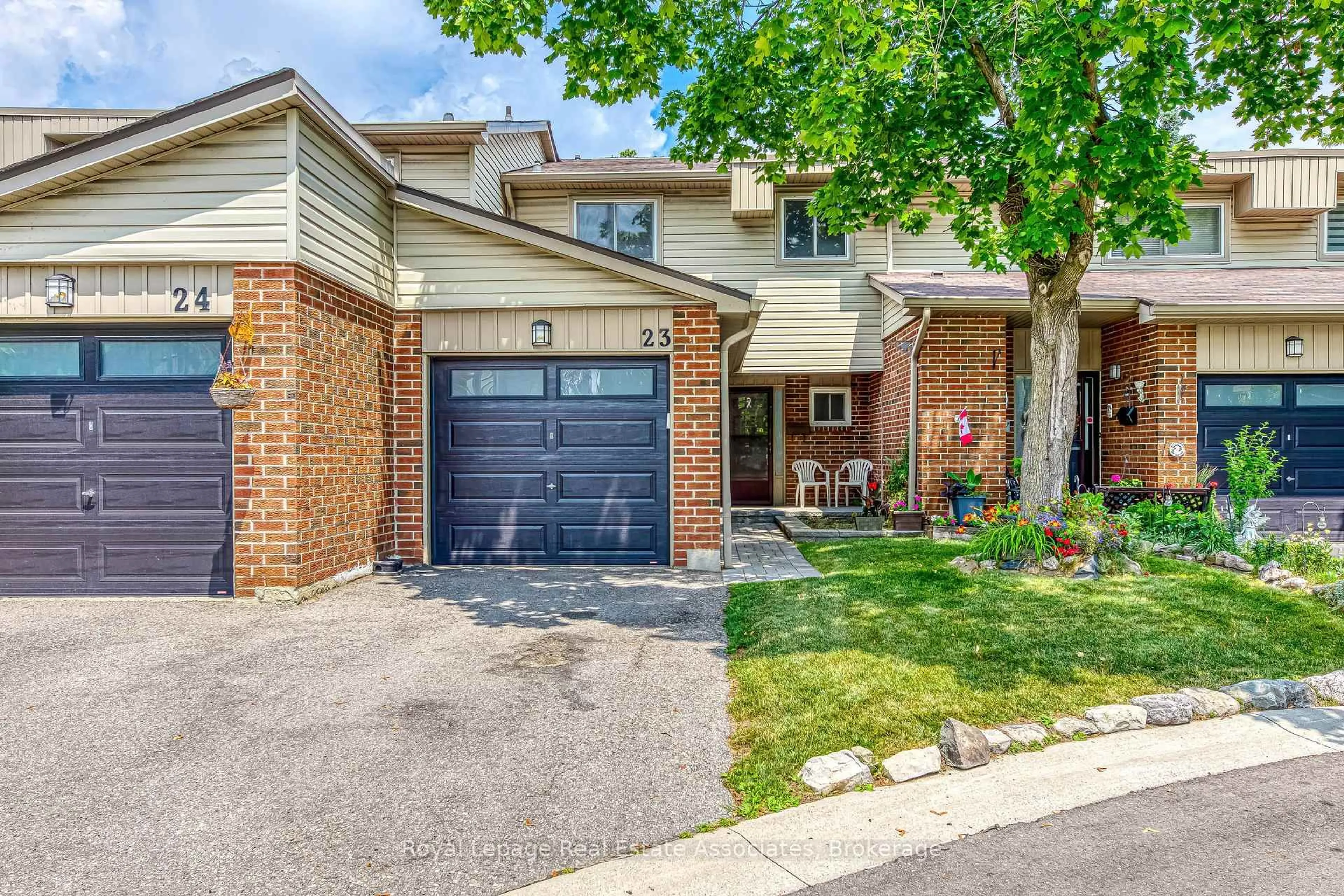 Home with brick exterior material, street for 485 Meadows Blvd #23, Mississauga Ontario L4Z 1H1