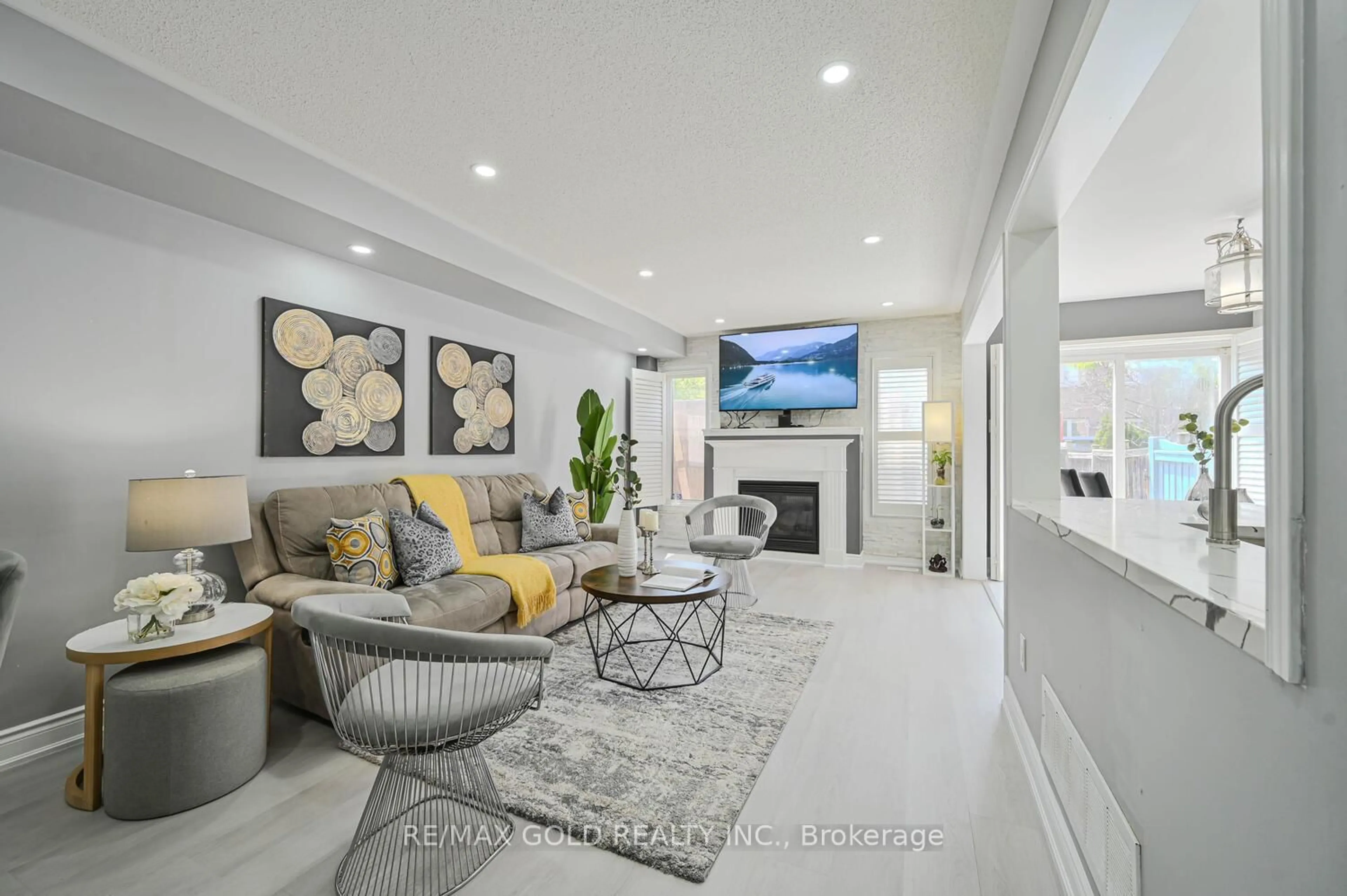 Living room with furniture, ceramic/tile floor for 4 Bamboo Grve, Brampton Ontario L6R 0L9