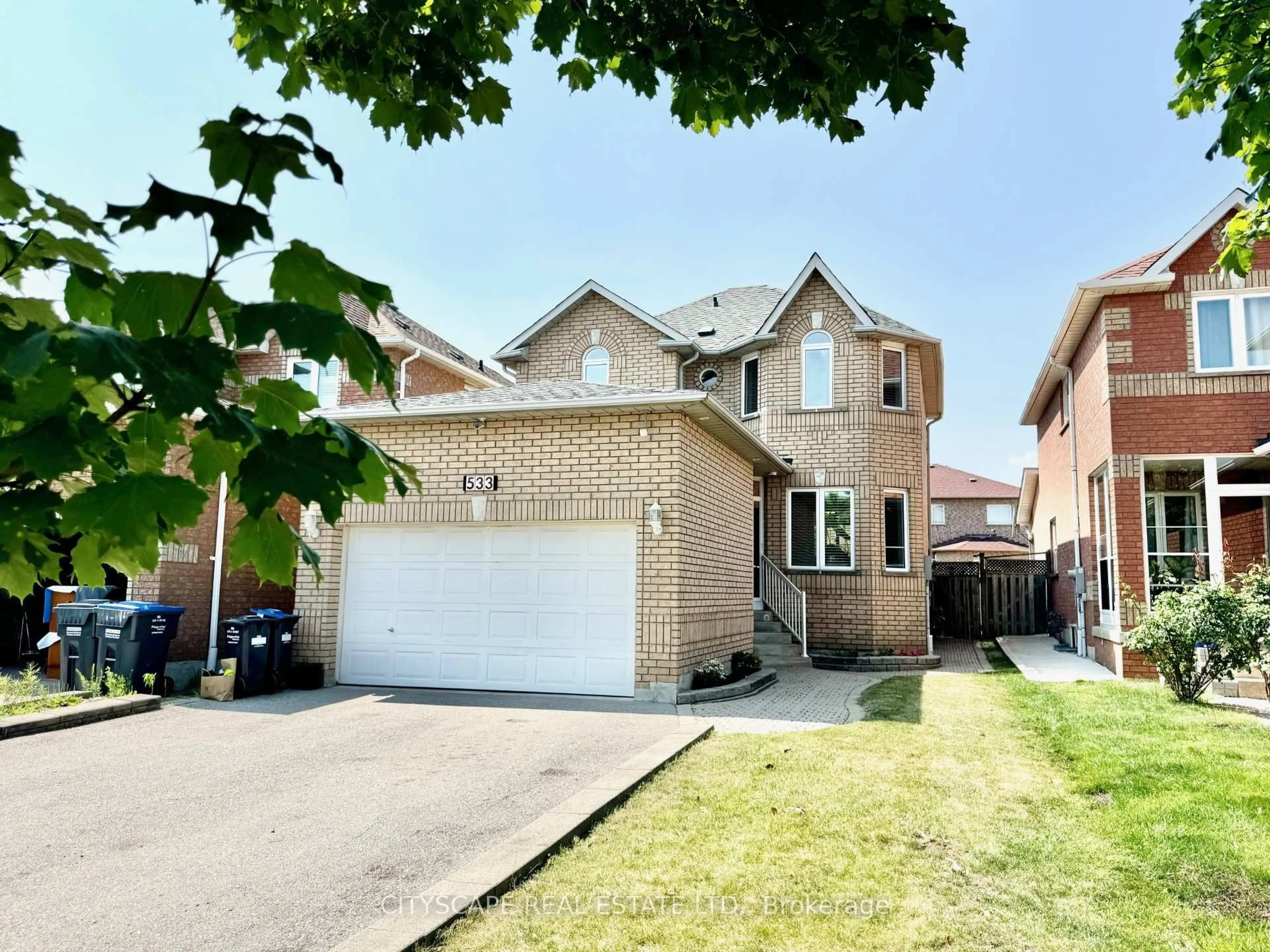 Home with brick exterior material, street for 533 Leatherleaf Dr, Mississauga Ontario L4Z 3Y5