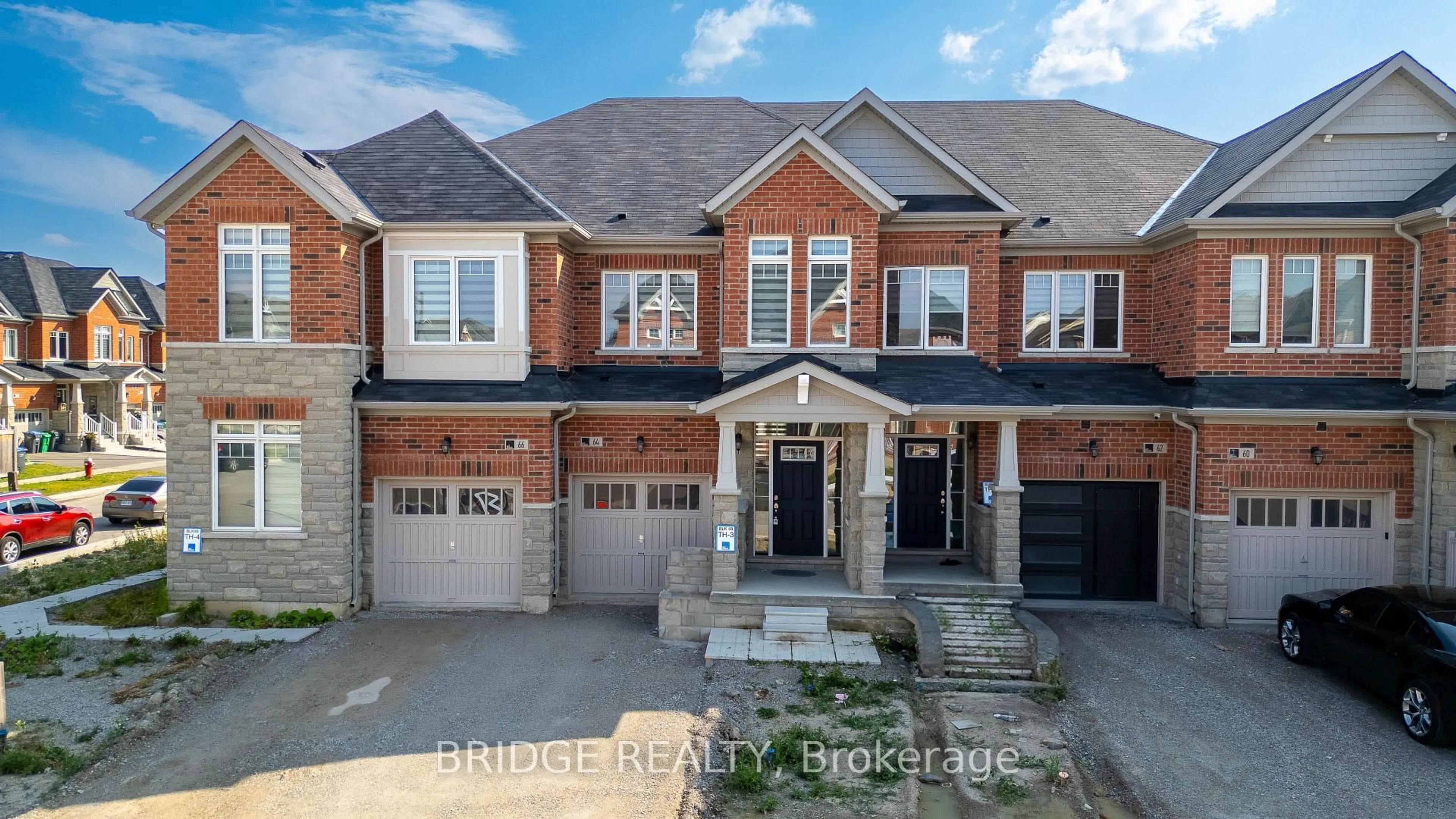 Home with brick exterior material, street for 64 Tundra Rd, Caledon Ontario L7C 4G9