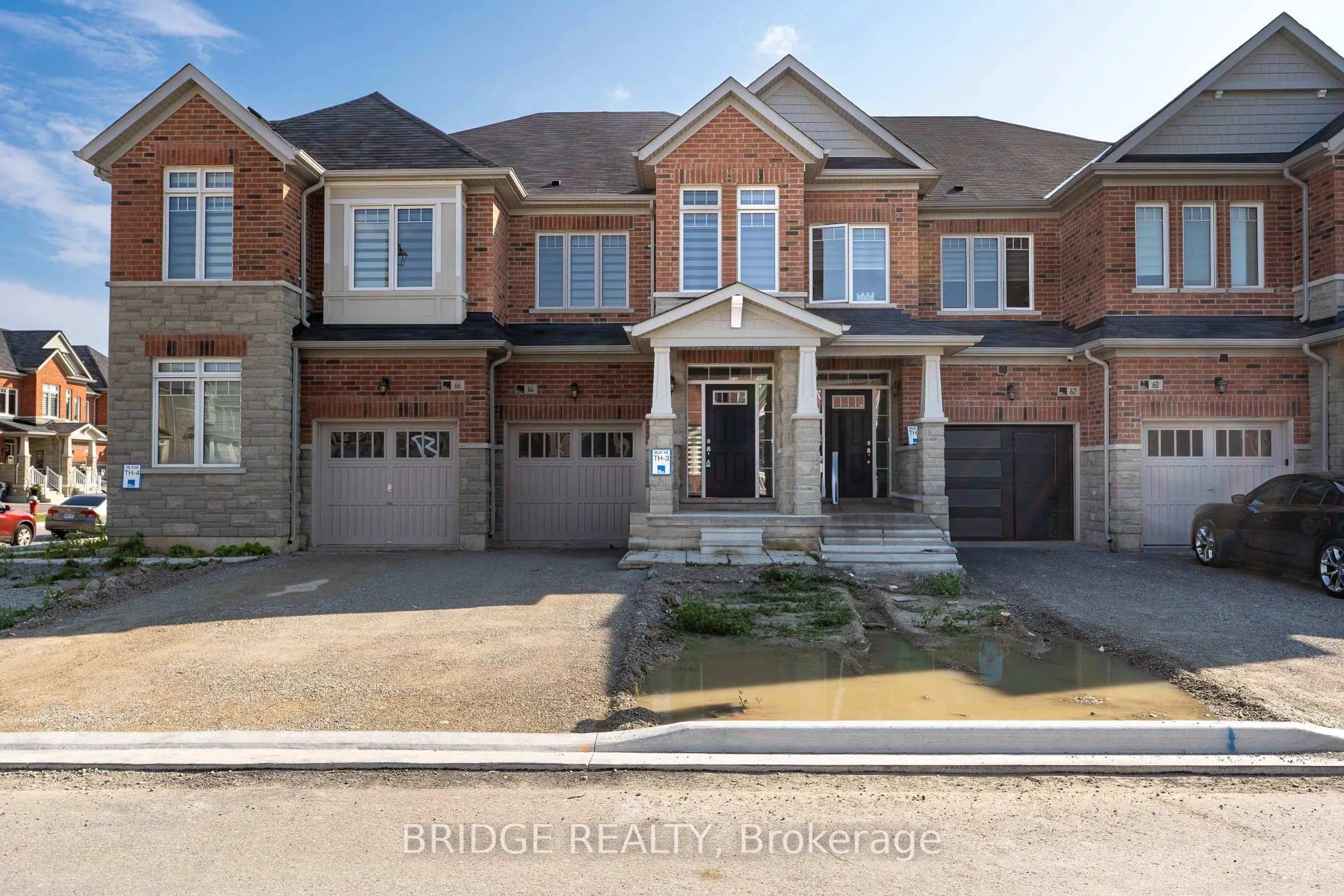 Home with brick exterior material, street for 64 Tundra Rd, Caledon Ontario L7C 4G9