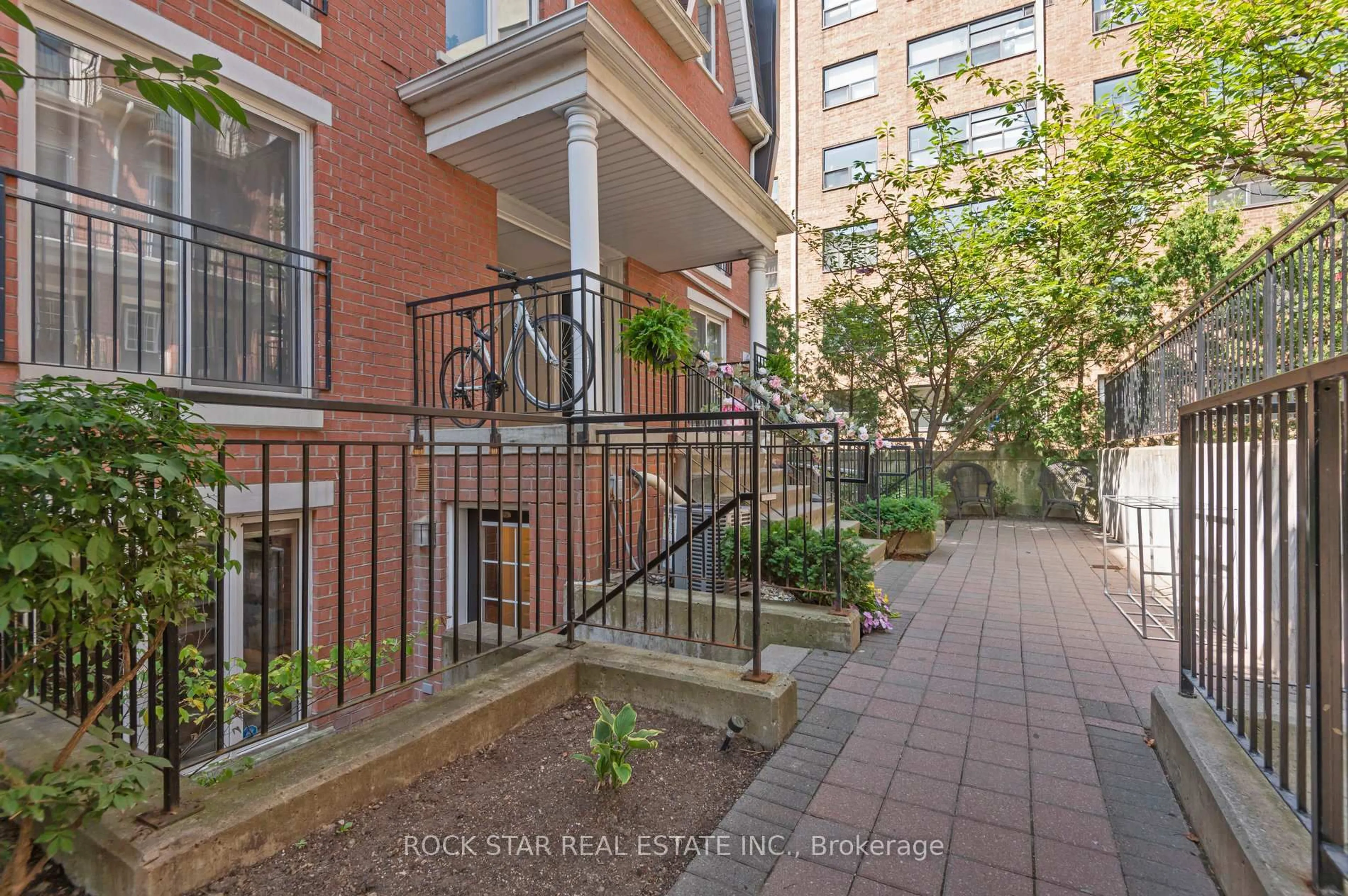Patio, city buildings view from balcony for 26 Laidlaw St #1526, Toronto Ontario M6K 1X2