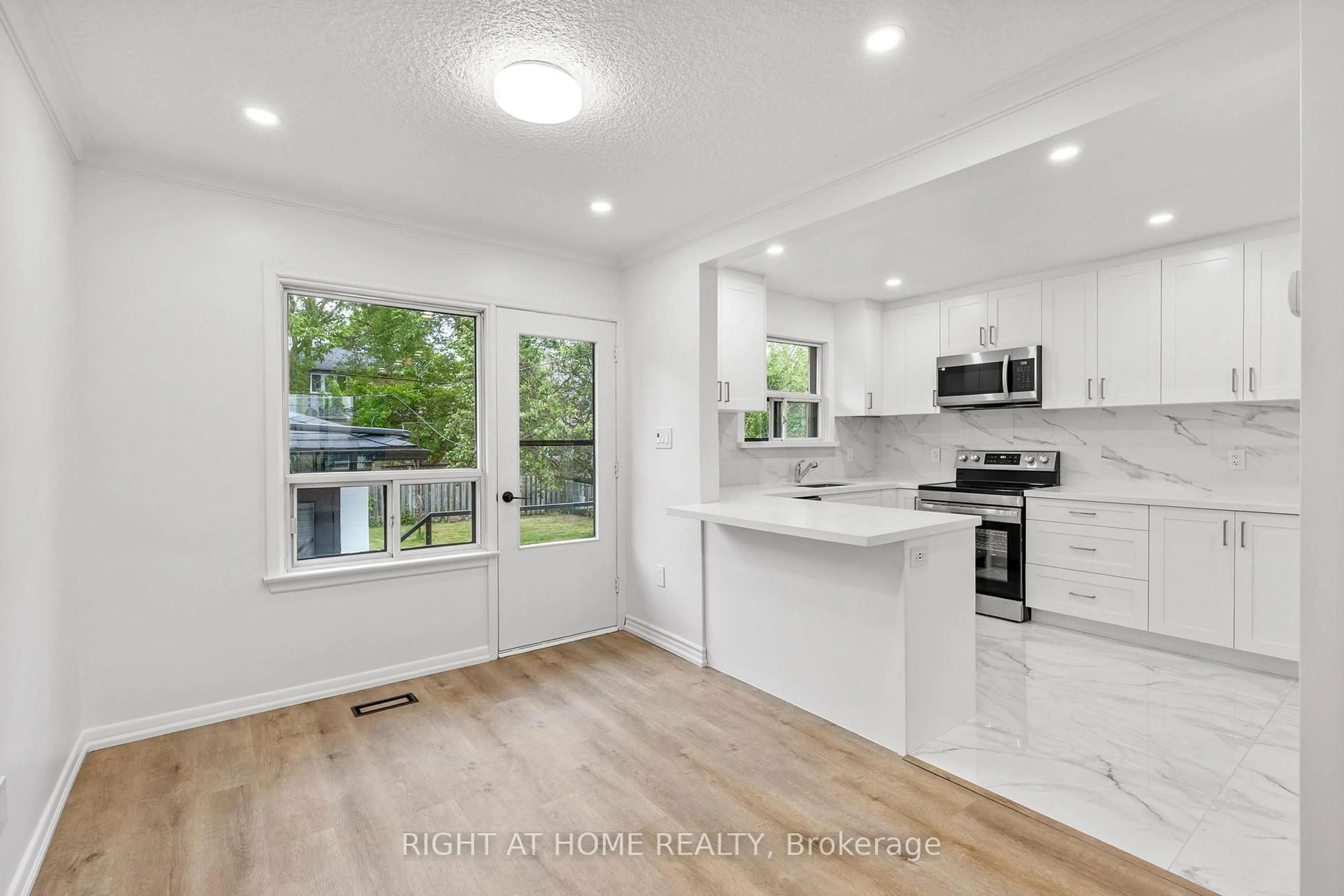 Open concept kitchen, unknown for 53 Lawnside Dr, Toronto Ontario M6L 1Z4