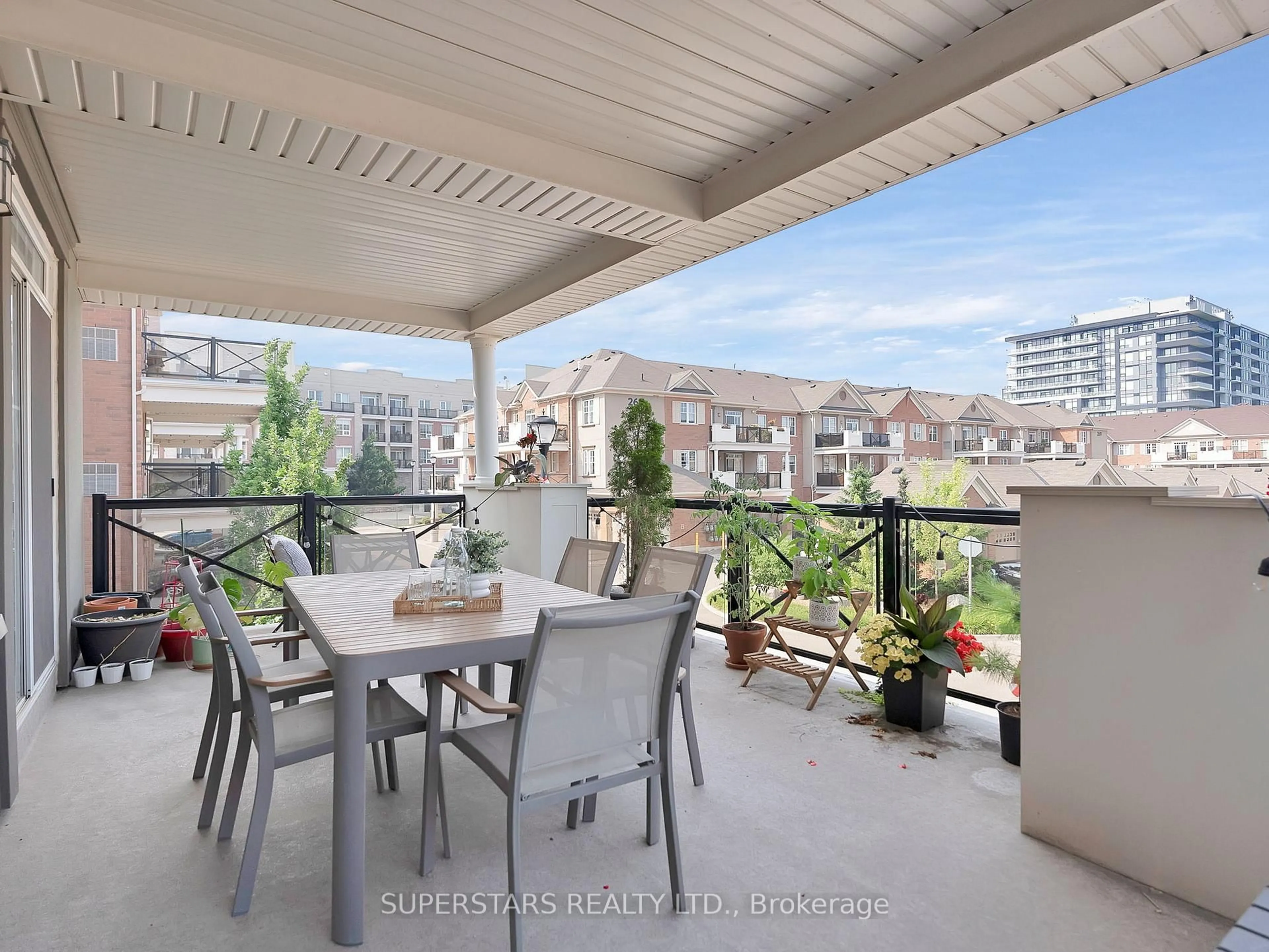 Patio, city buildings view from balcony for 2333 Sawgrass Dr #201, Oakville Ontario L6H 0L2