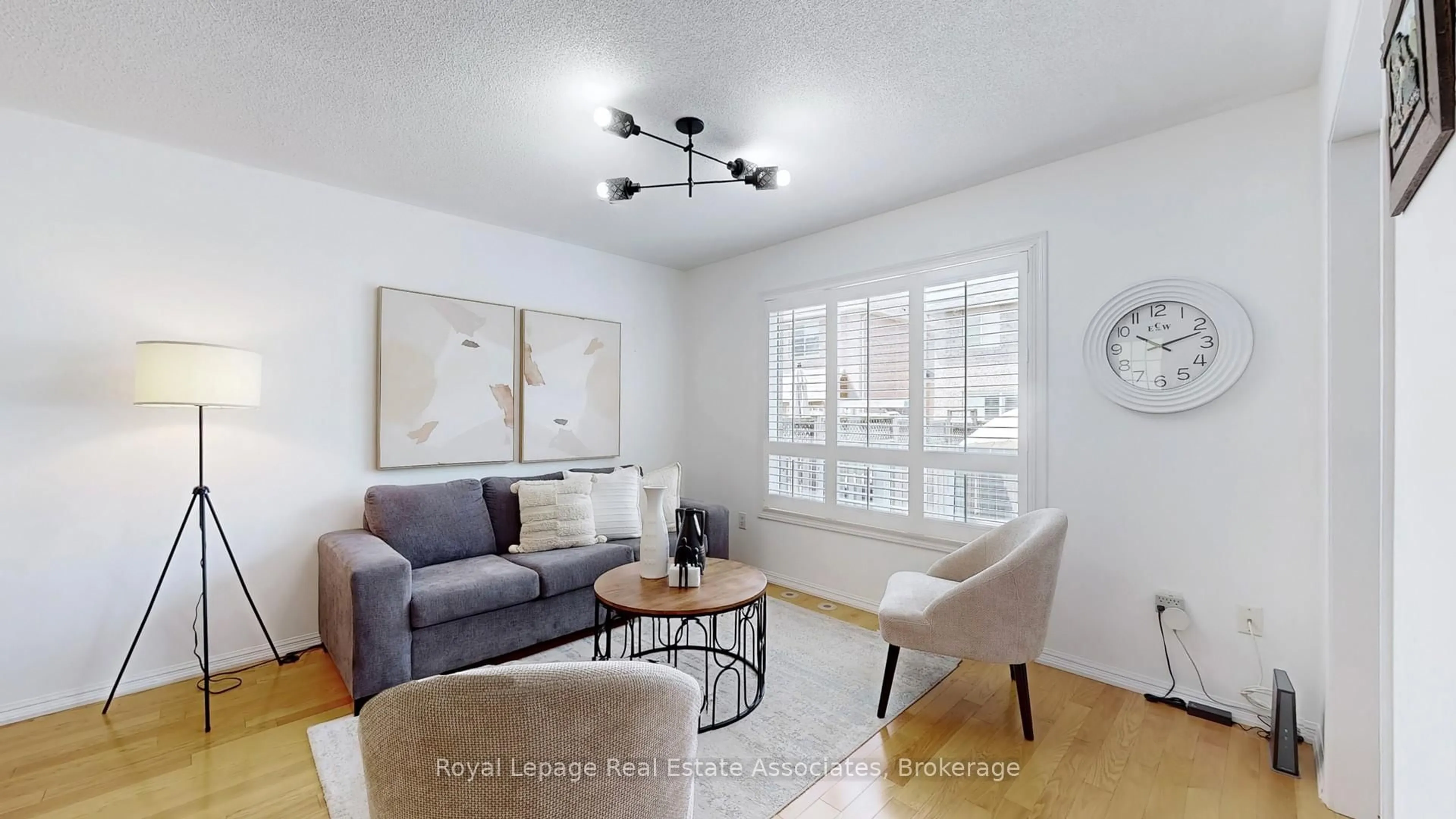 Living room with furniture, wood/laminate floor for 721 Shortreed Cres, Milton Ontario L9T 0E7