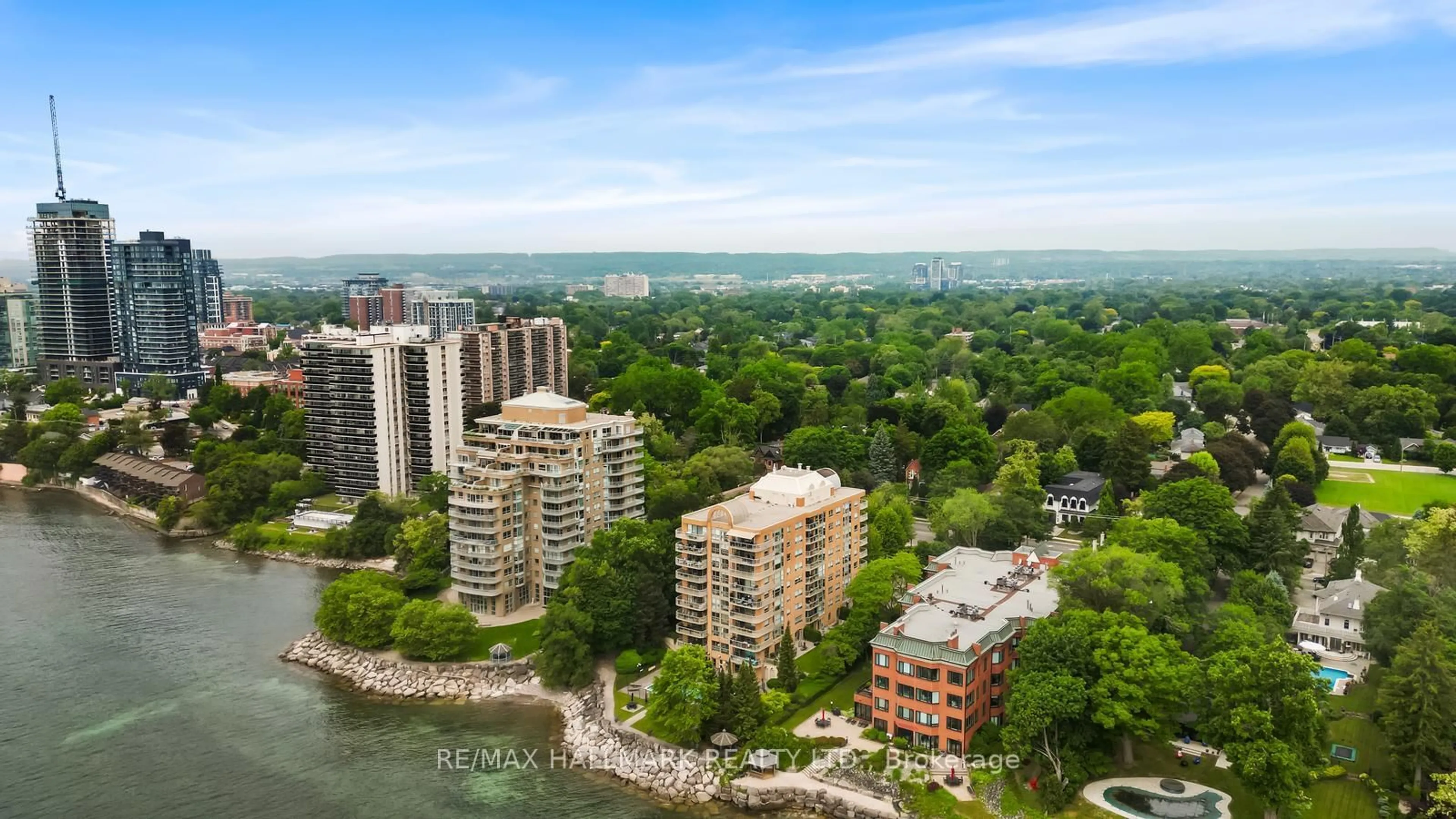 A pic from outside/outdoor area/front of a property/back of a property/a pic from drone, water/lake/river/ocean view for 2210 Lakeshore Rd #104, Burlington Ontario L7R 4J9