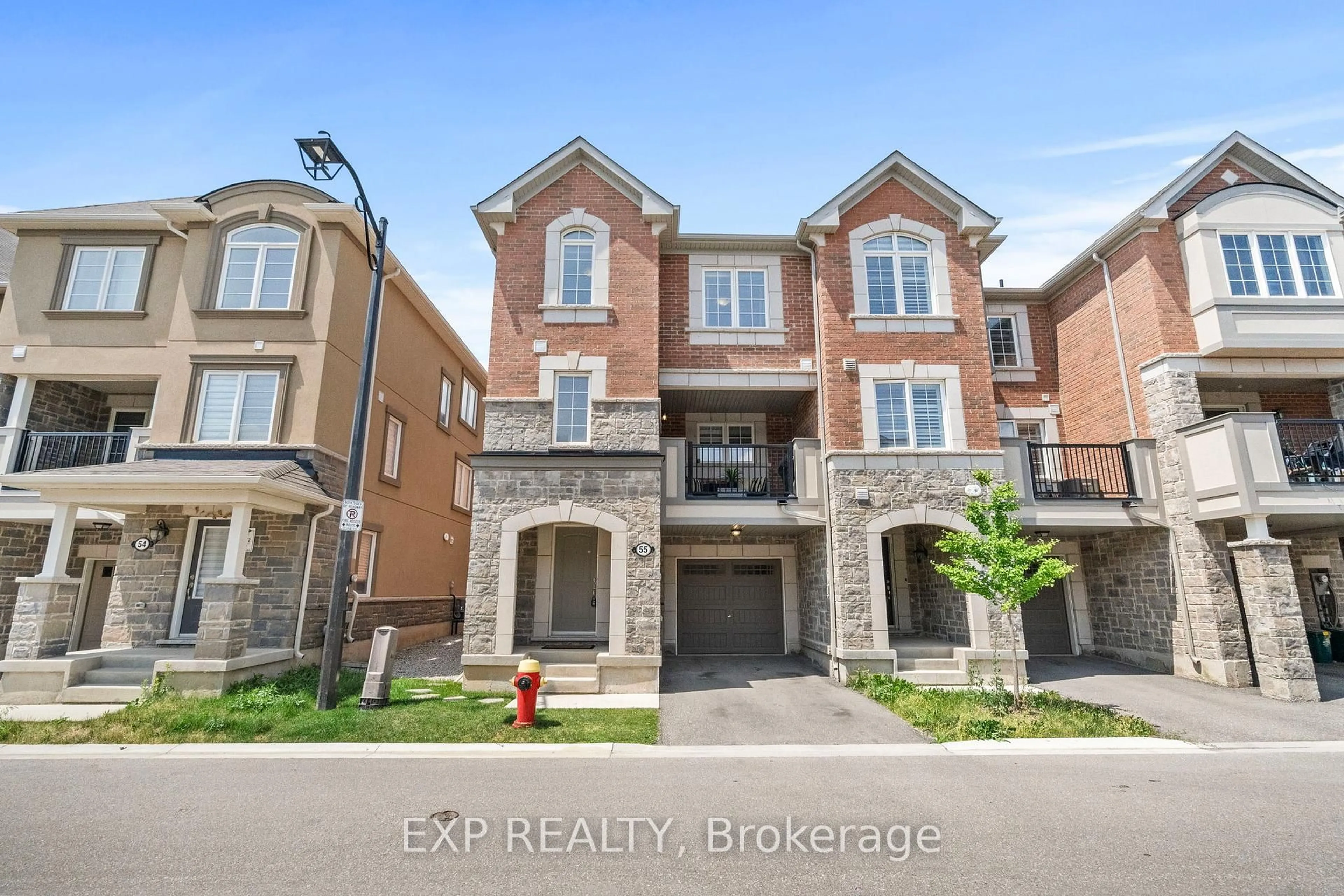A pic from outside/outdoor area/front of a property/back of a property/a pic from drone, street for 975 Whitlock Ave #55, Milton Ontario L9E 1S9