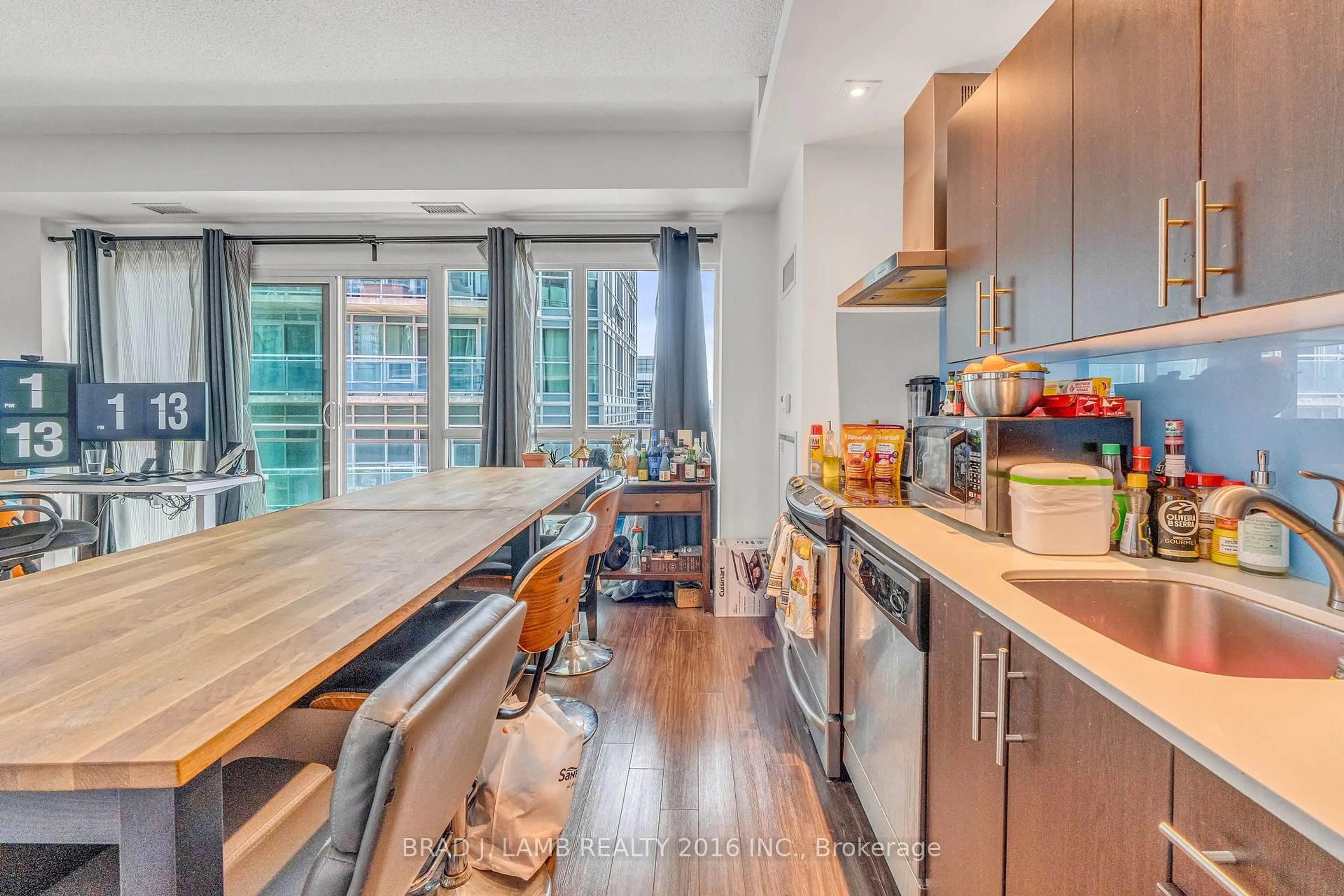 Open concept kitchen, wood/laminate floor for 165 Legion Rd #1031, Toronto Ontario M8Y 0A1