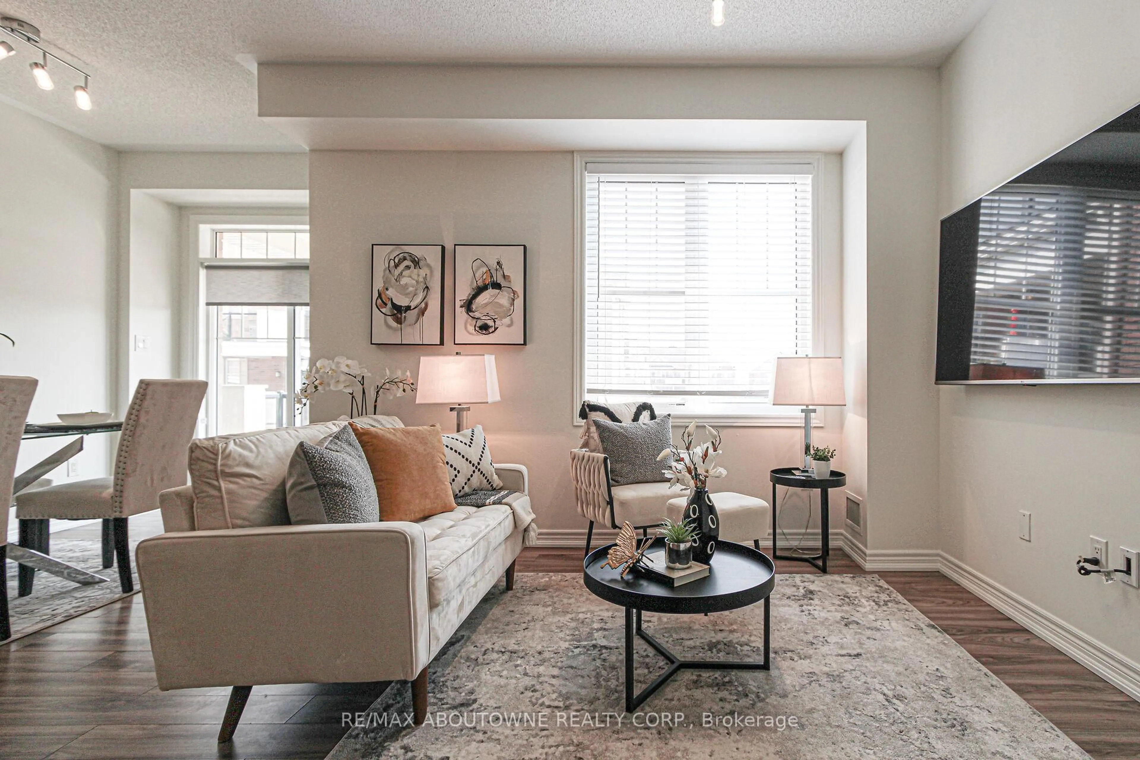 Living room with furniture, unknown for 2339 Sawgrass Dr #206, Oakville Ontario L6H 0L1