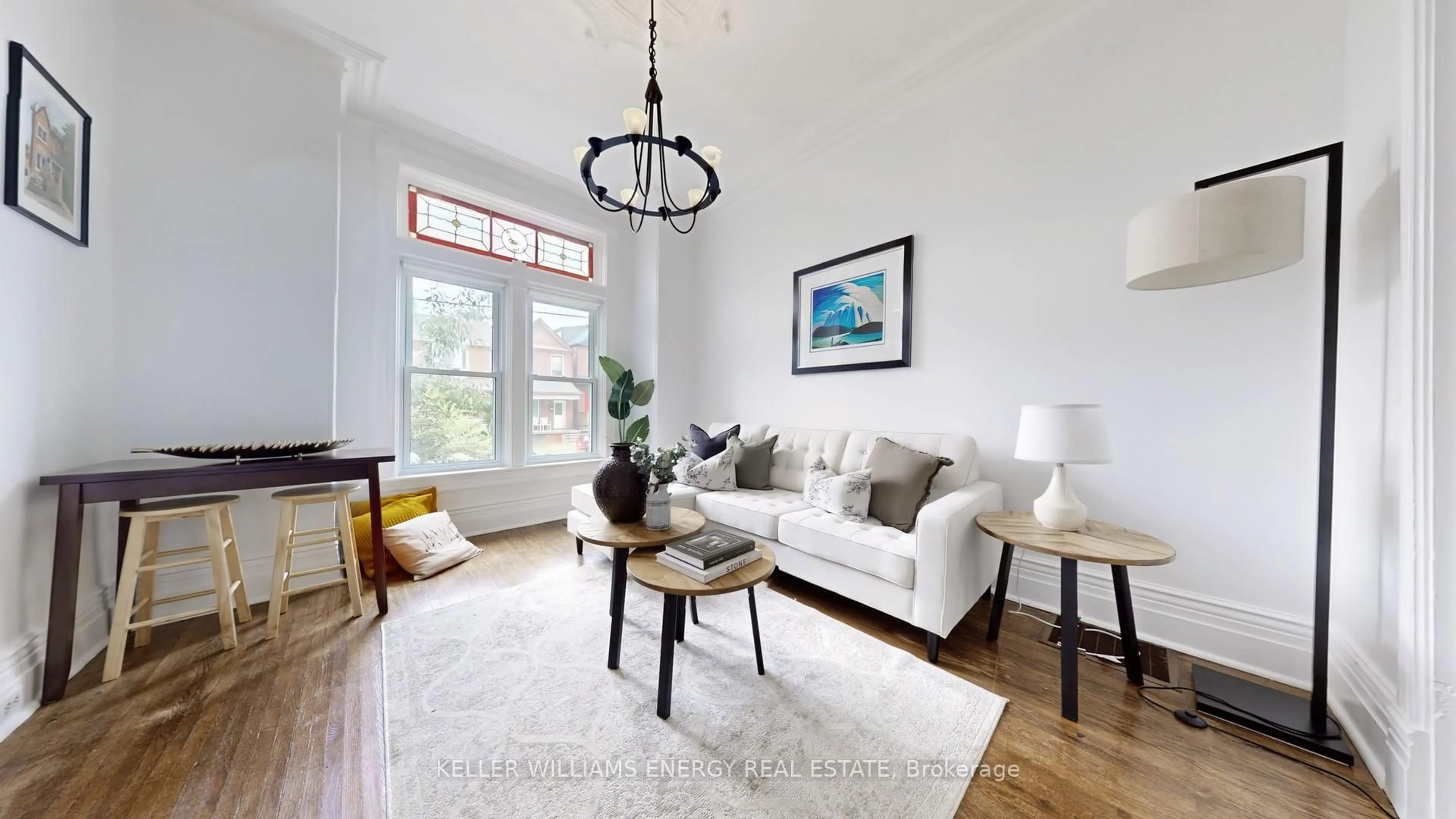Living room with furniture, wood/laminate floor for 511 Perth Ave, Toronto Ontario M6N 2W6