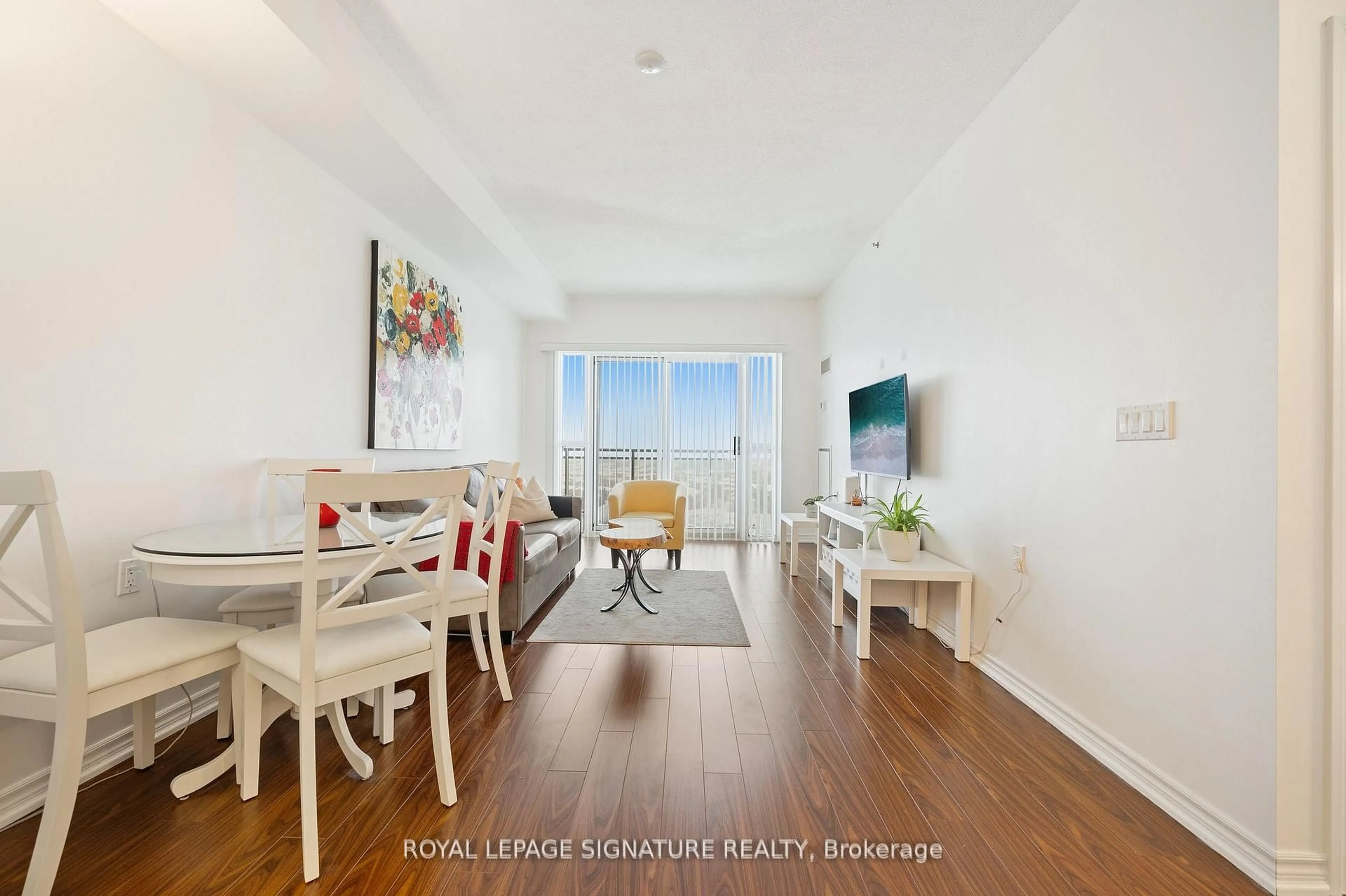 Living room with furniture, wood/laminate floor for 810 Scollard Crt #1003, Mississauga Ontario L5V 0A7