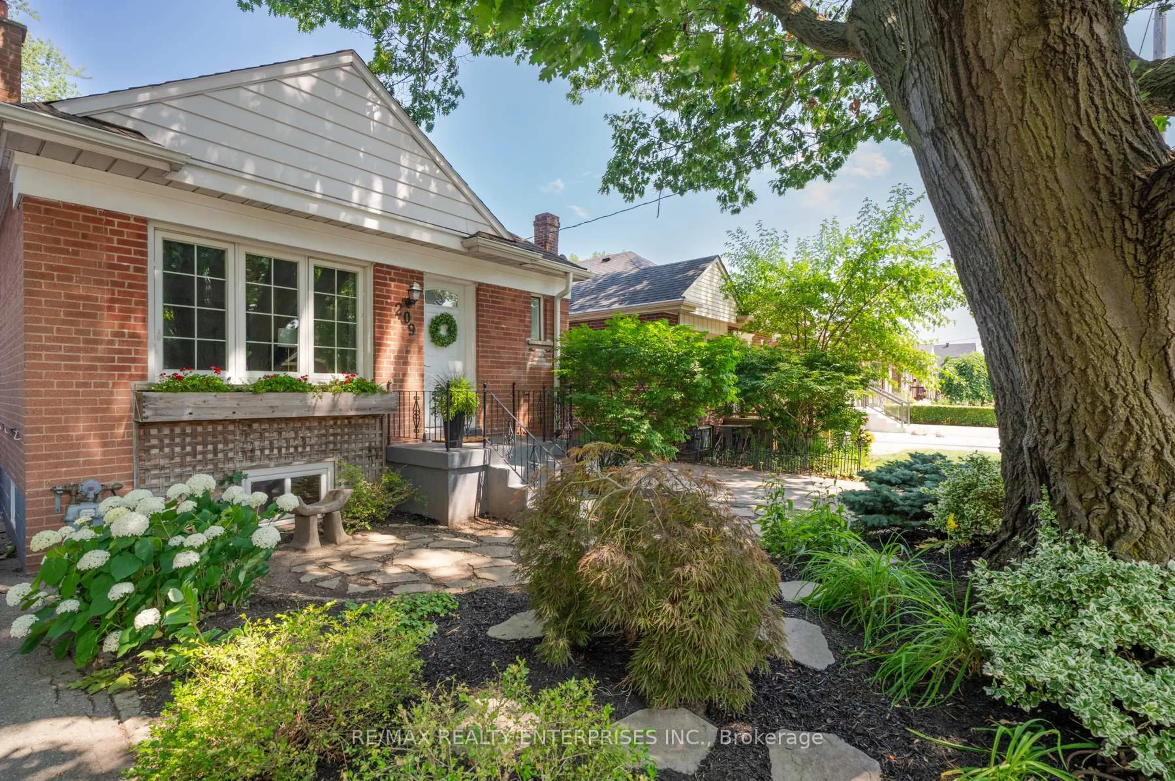 Home with brick exterior material, street for 209 Hallmark Ave, Toronto Ontario M8W 4L1