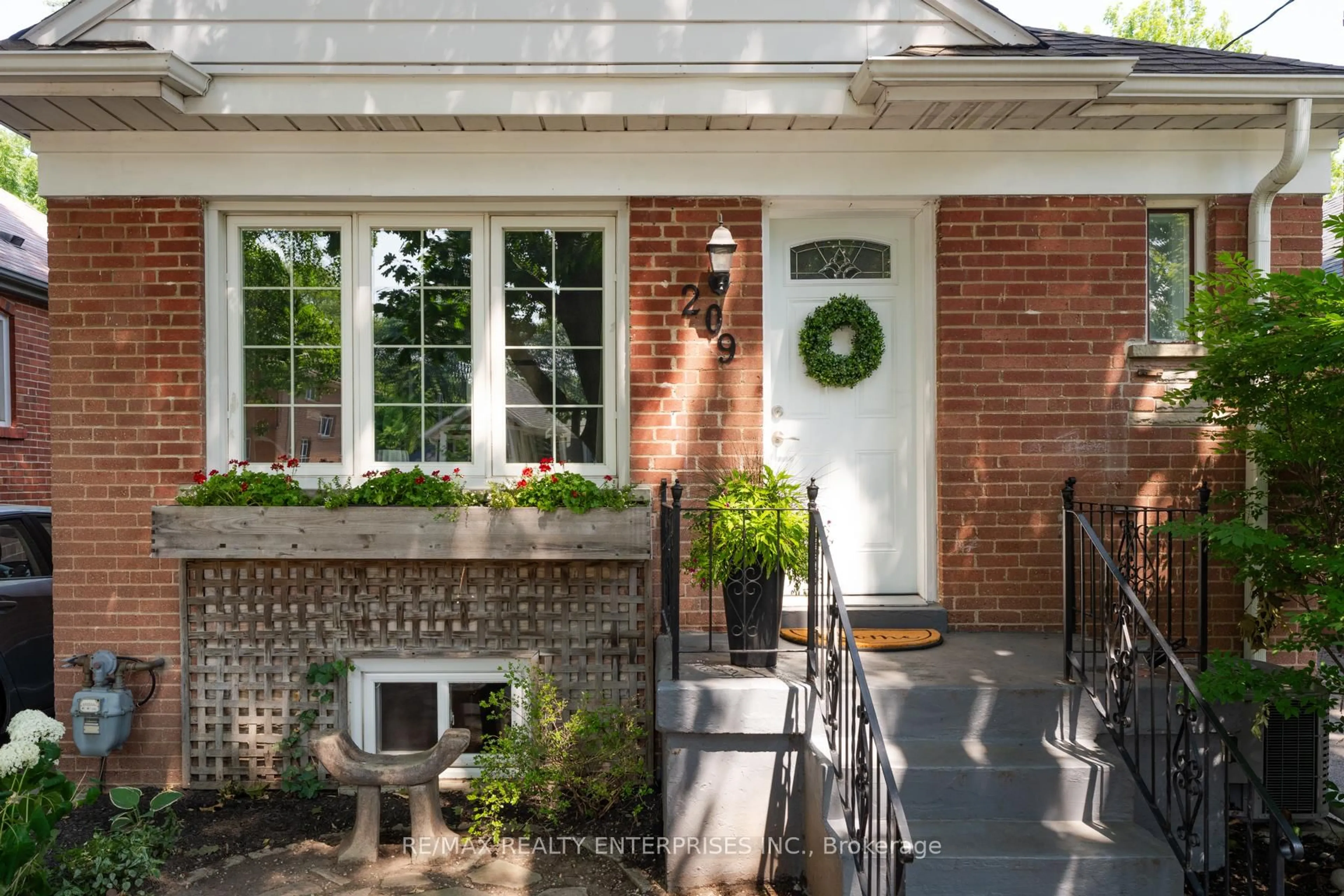 Home with brick exterior material, street for 209 Hallmark Ave, Toronto Ontario M8W 4L1