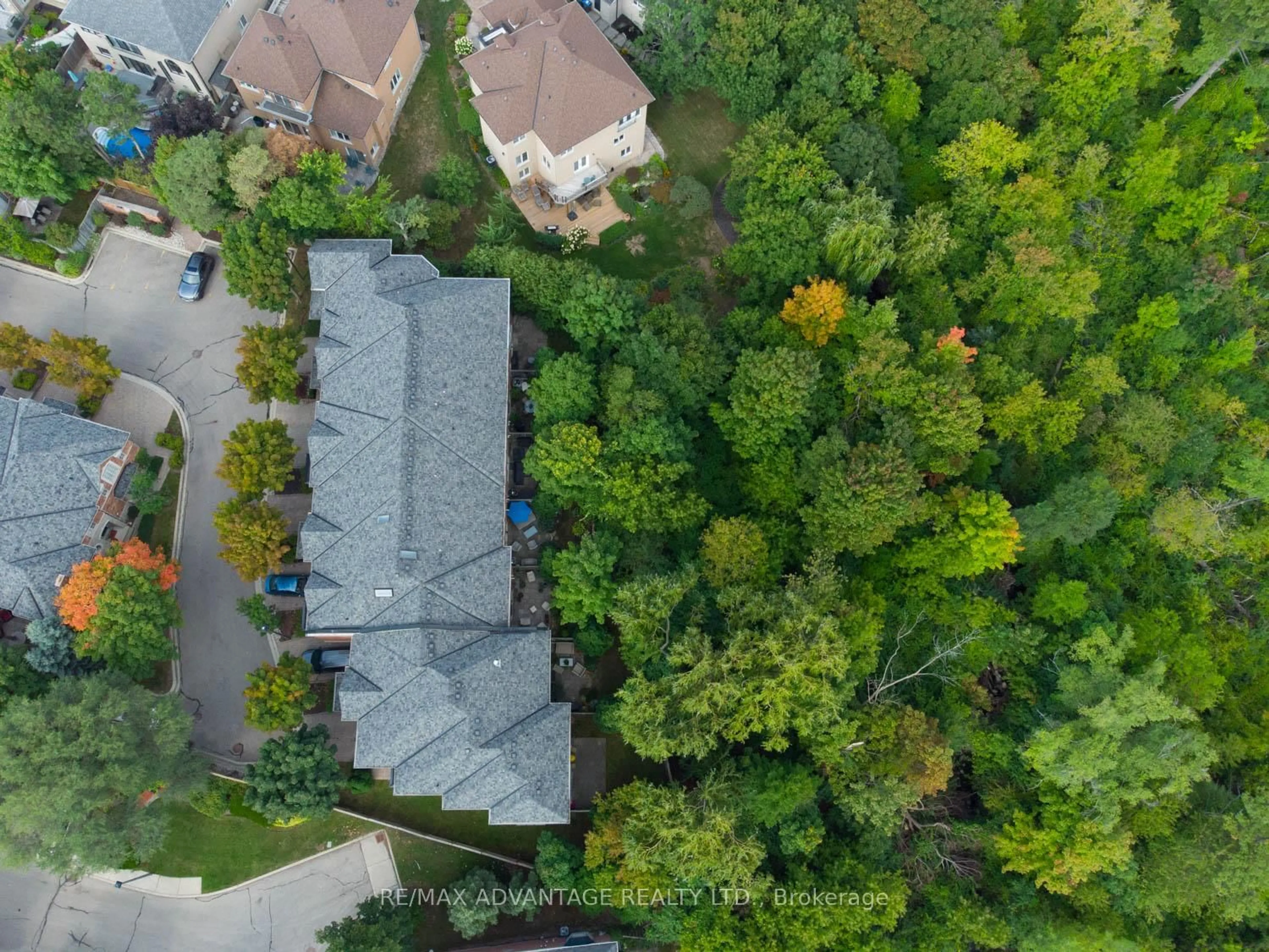 A pic from outside/outdoor area/front of a property/back of a property/a pic from drone, forest/trees view for 2401 Fifth Line #27, Mississauga Ontario L5K 1V9