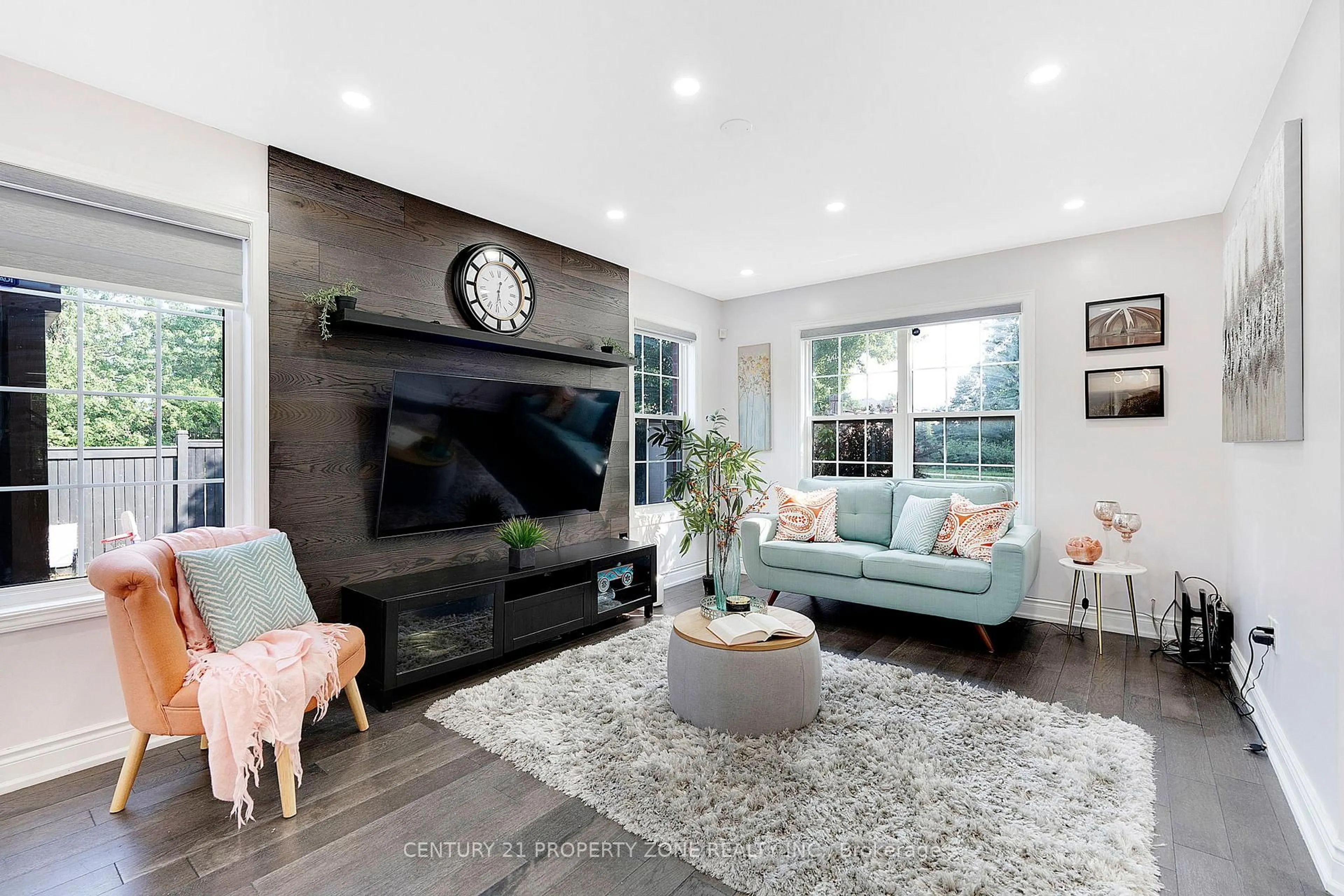 Living room with furniture, wood/laminate floor for 185 Brisdale Dr, Brampton Ontario L7A 2T2