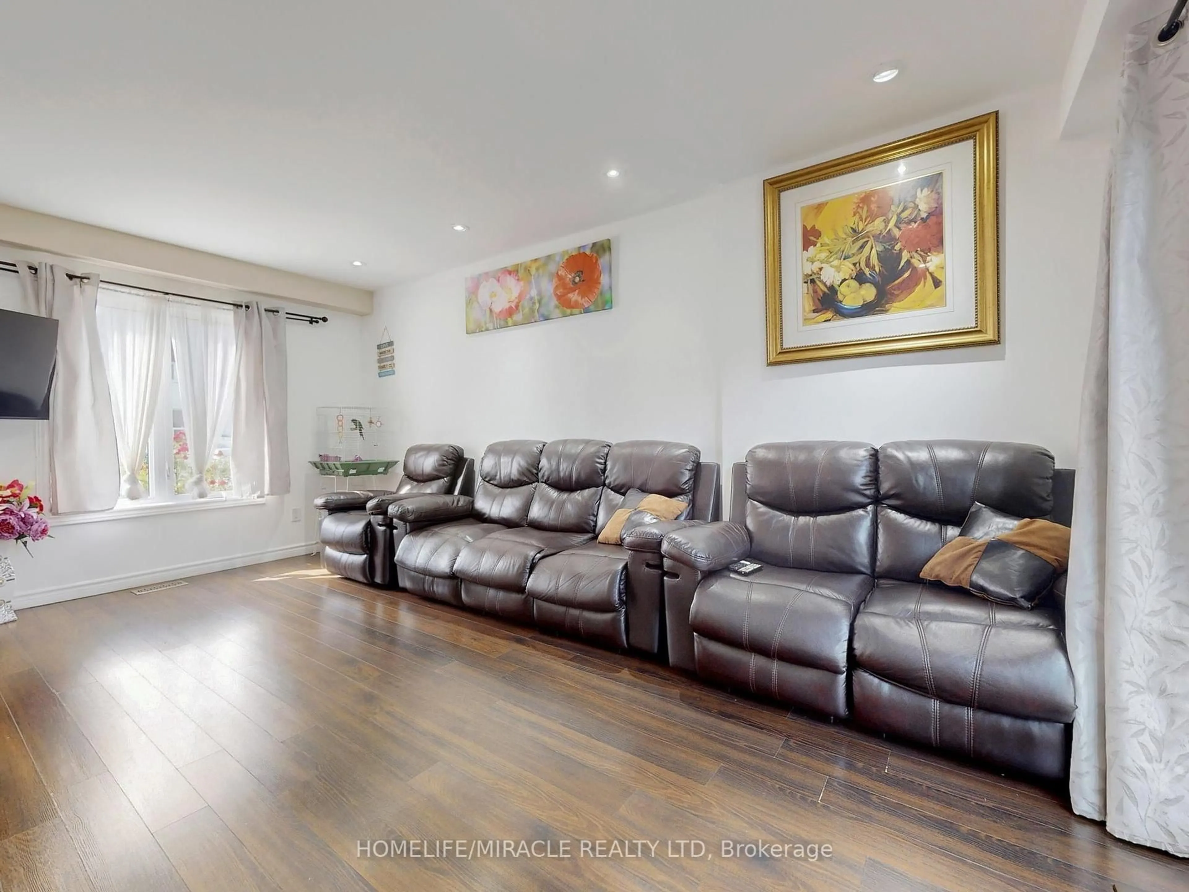 Living room with furniture, wood/laminate floor for 14 Hawkins Crt, Brampton Ontario L6S 2N7