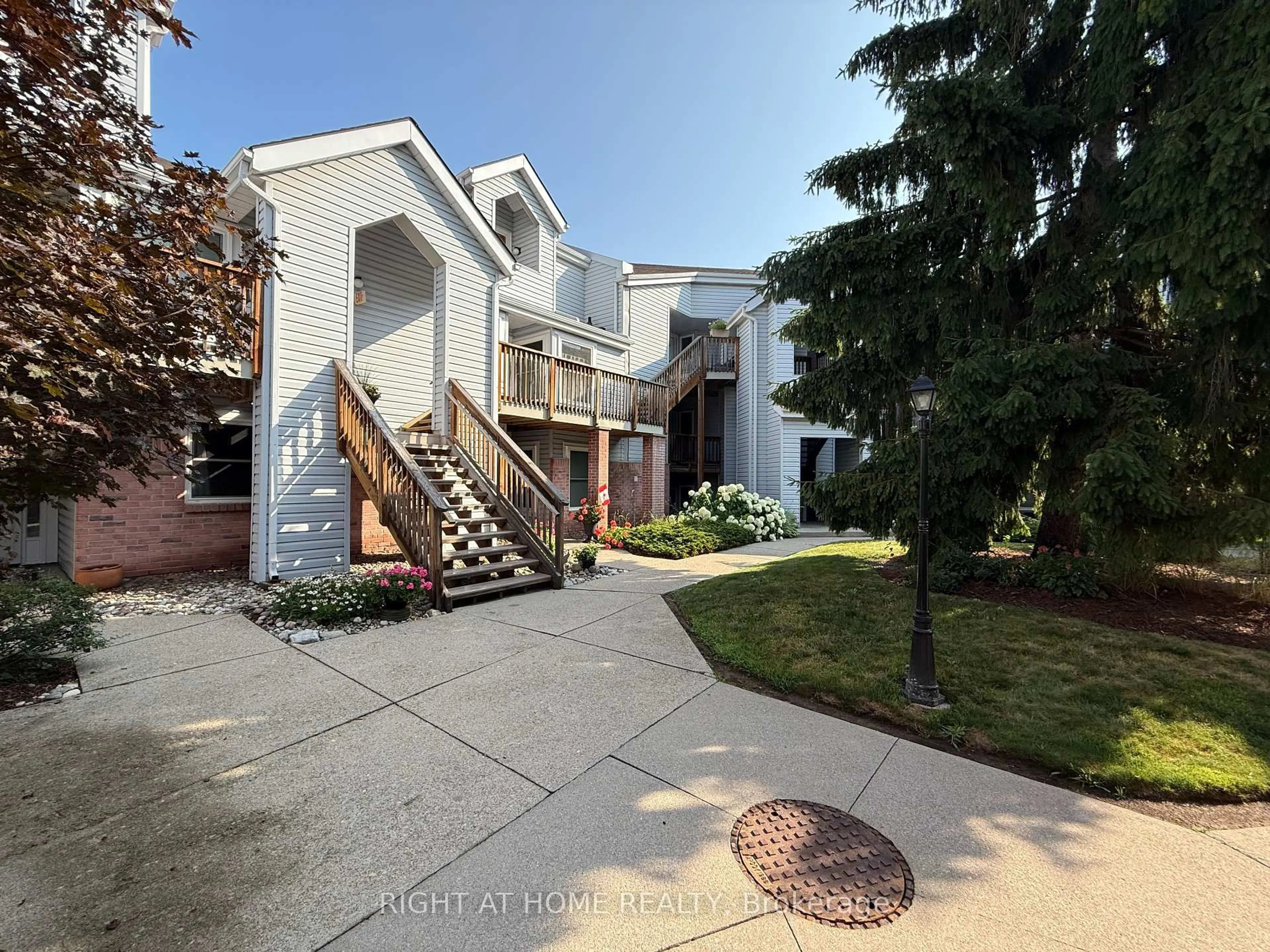 A pic from outside/outdoor area/front of a property/back of a property/a pic from drone, street for 1220 Thorpe Rd #214, Burlington Ontario L7S 2H5