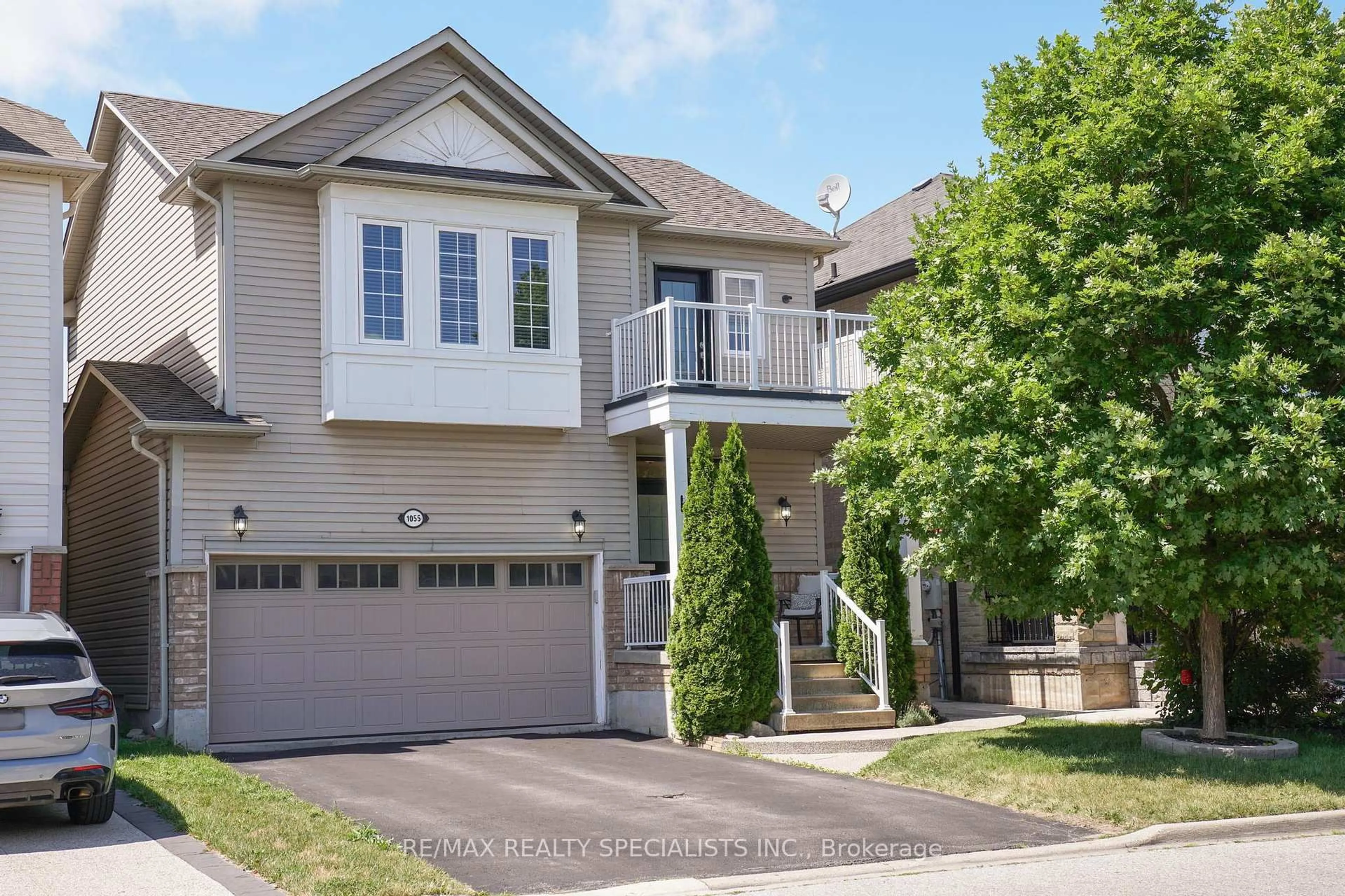 Home with vinyl exterior material, street for 1055 Eager Rd, Milton Ontario L9T 6T1
