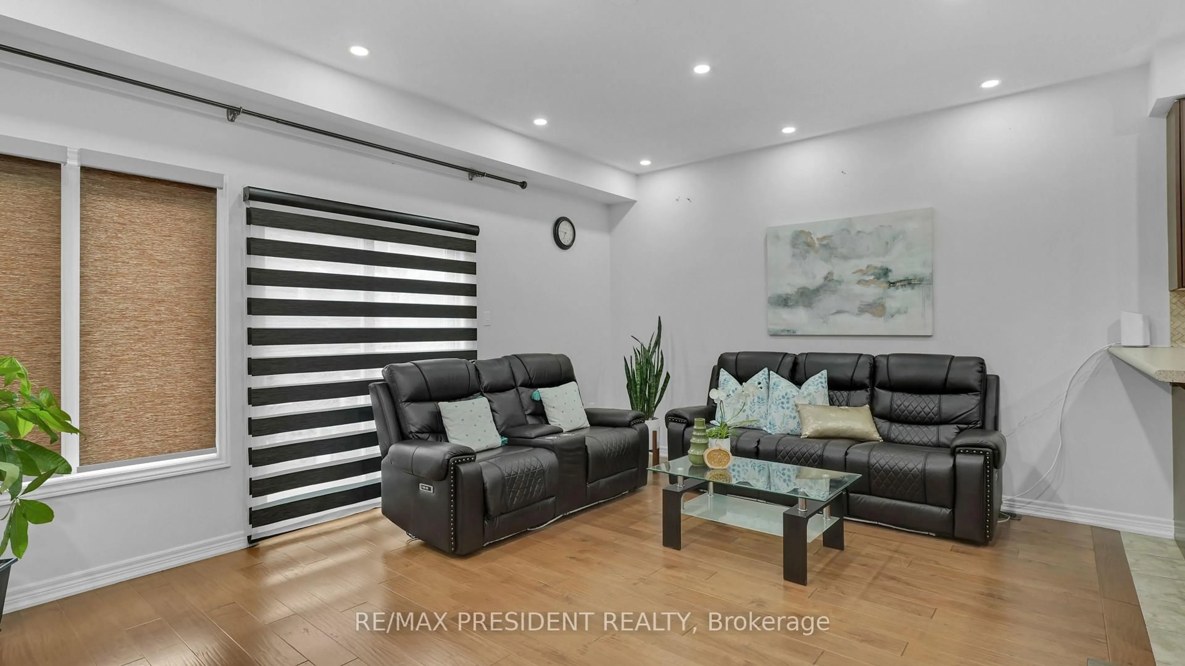 Living room with furniture, wood/laminate floor for 17 Frenchpark Circ, Brampton Ontario L6X 0Y6
