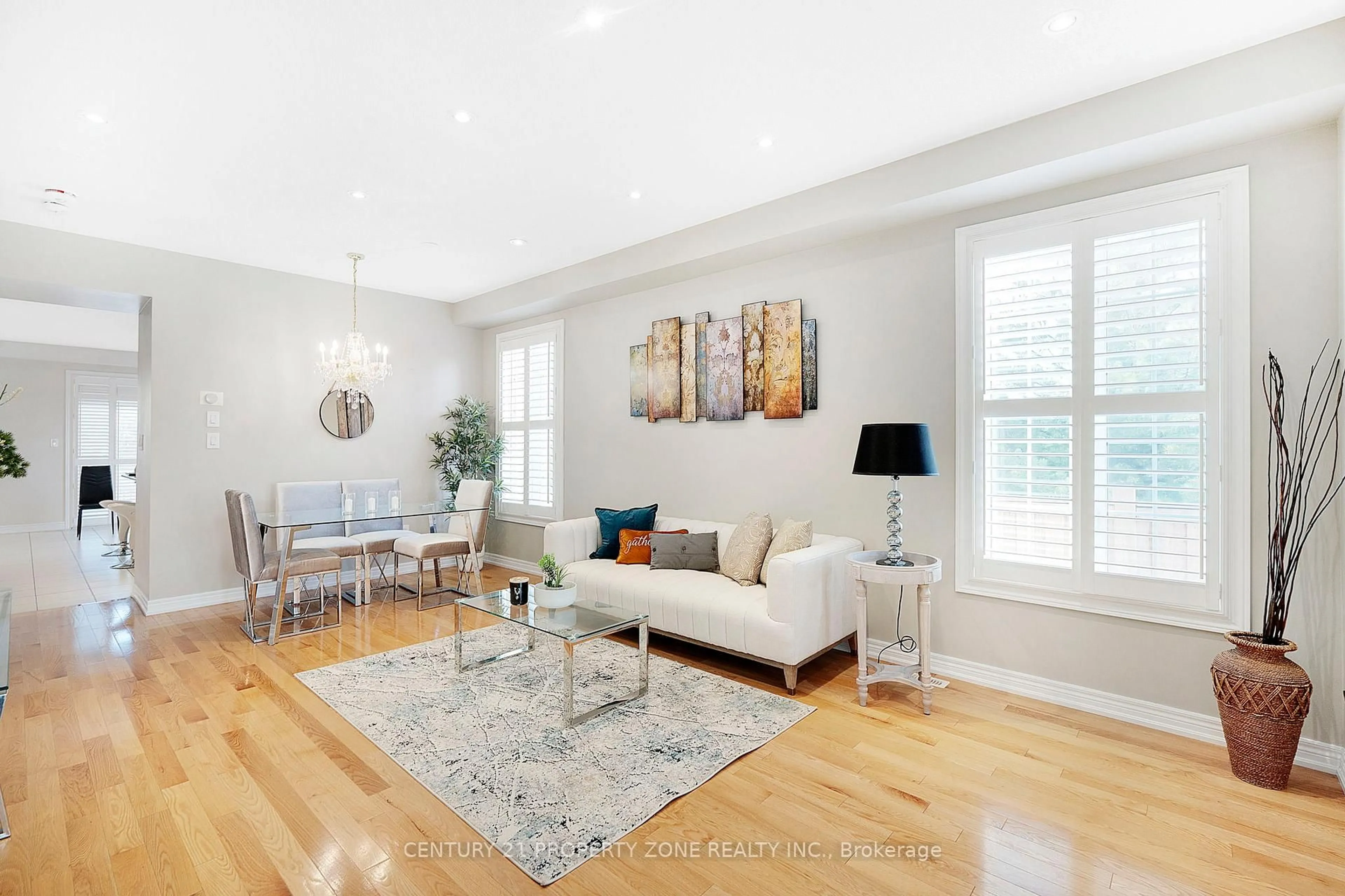 Living room with furniture, wood/laminate floor for 161 Bonnie Braes Dr, Brampton Ontario L6Y 0H8