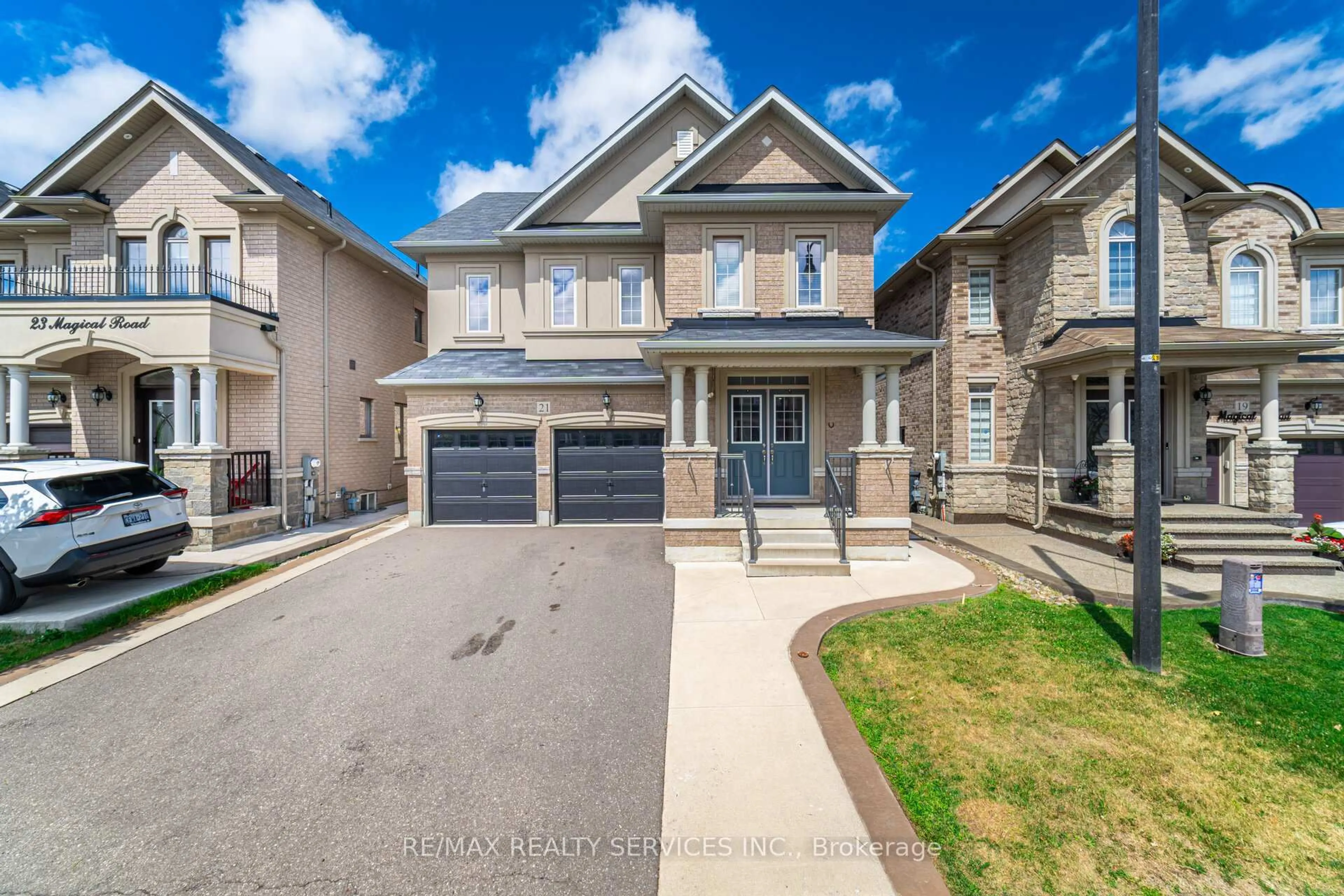 Home with brick exterior material, street for 21 Magical Rd, Brampton Ontario L7A 4P8