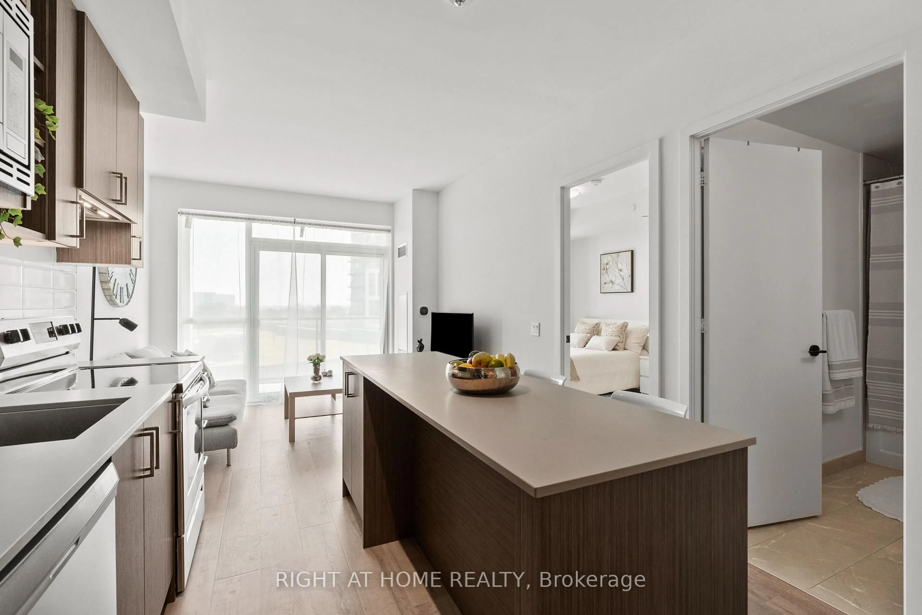 Open concept kitchen, wood/laminate floor for 60 George Butchart Dr #509, Toronto Ontario M3K 0E1