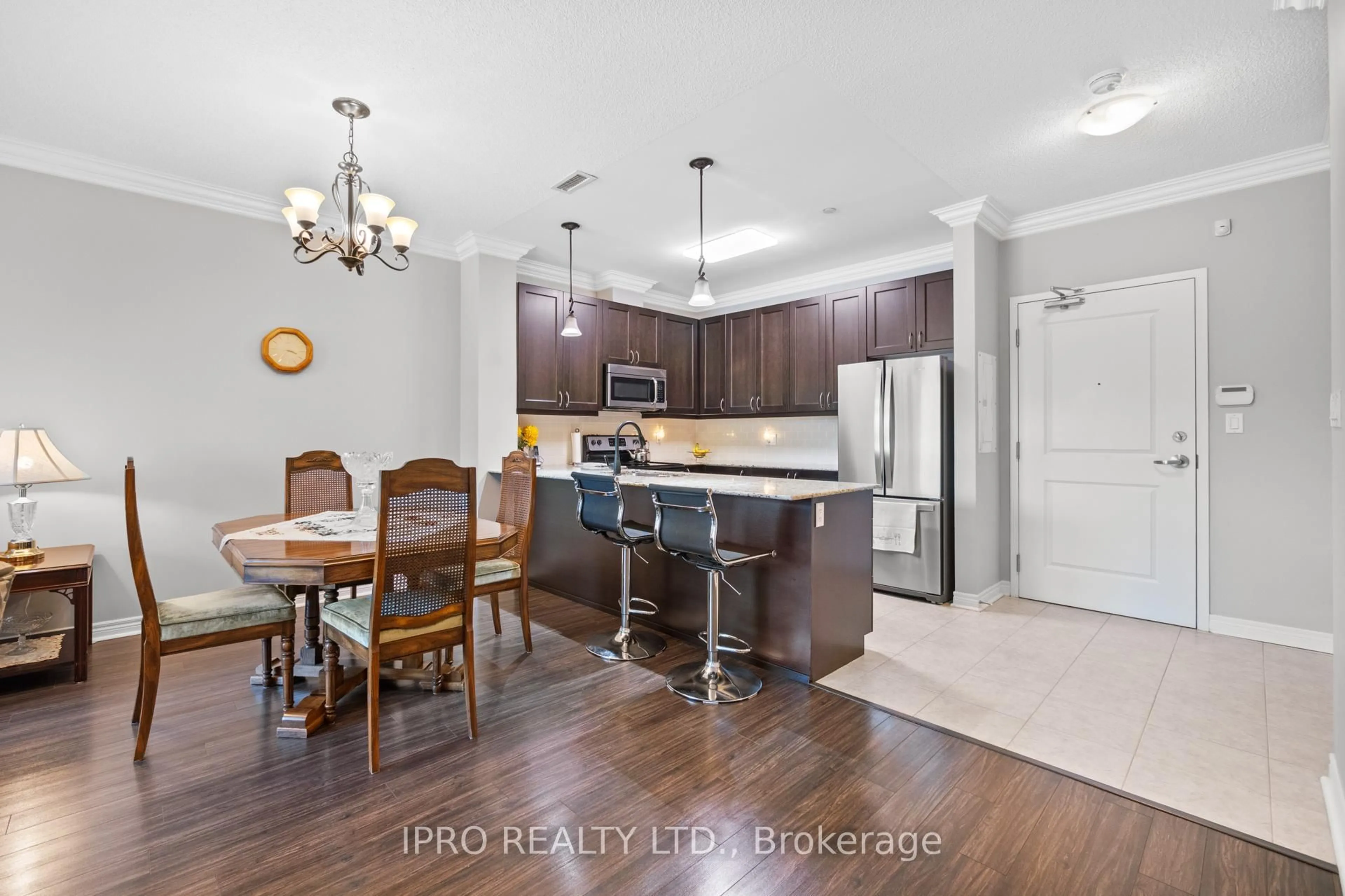 Open concept kitchen, wood/laminate floor for 33 Whitmer St #112, Milton Ontario L9T 8P9